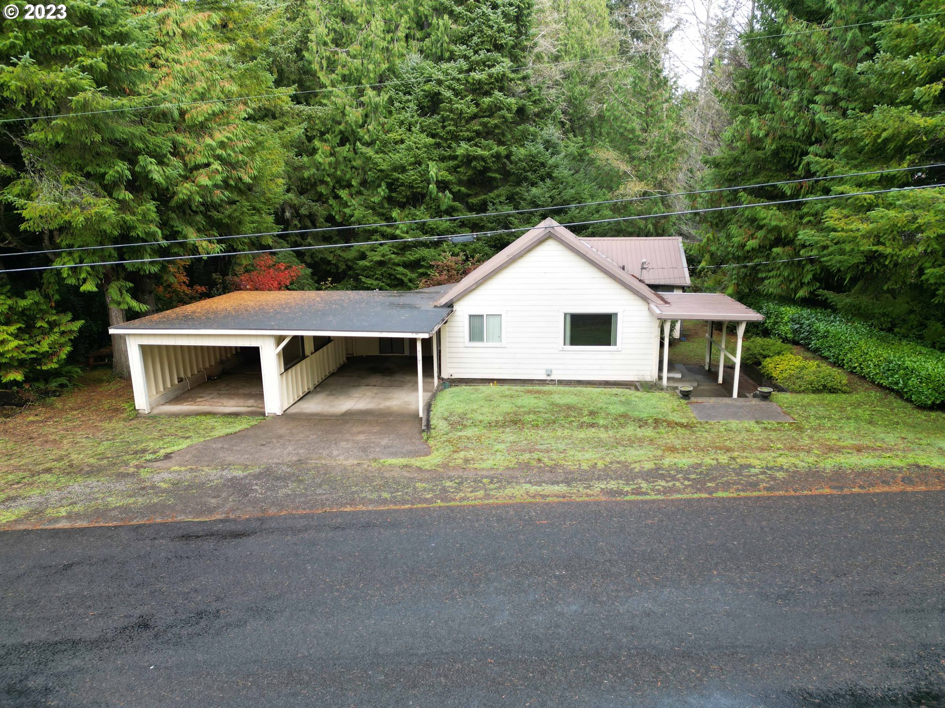 Lots of potential with this 2 bedroom, 1 bathroom home on 1.16 acres. Located just South of Florence only minutes from sand dunes, camping, fishing, etc. Living room features newer mini split heat pump. Laundry/storage room off of kitchen and leading to carport. Plenty of parking space in driveway & attached 2-car carport. Septic tank will need to be replaced.