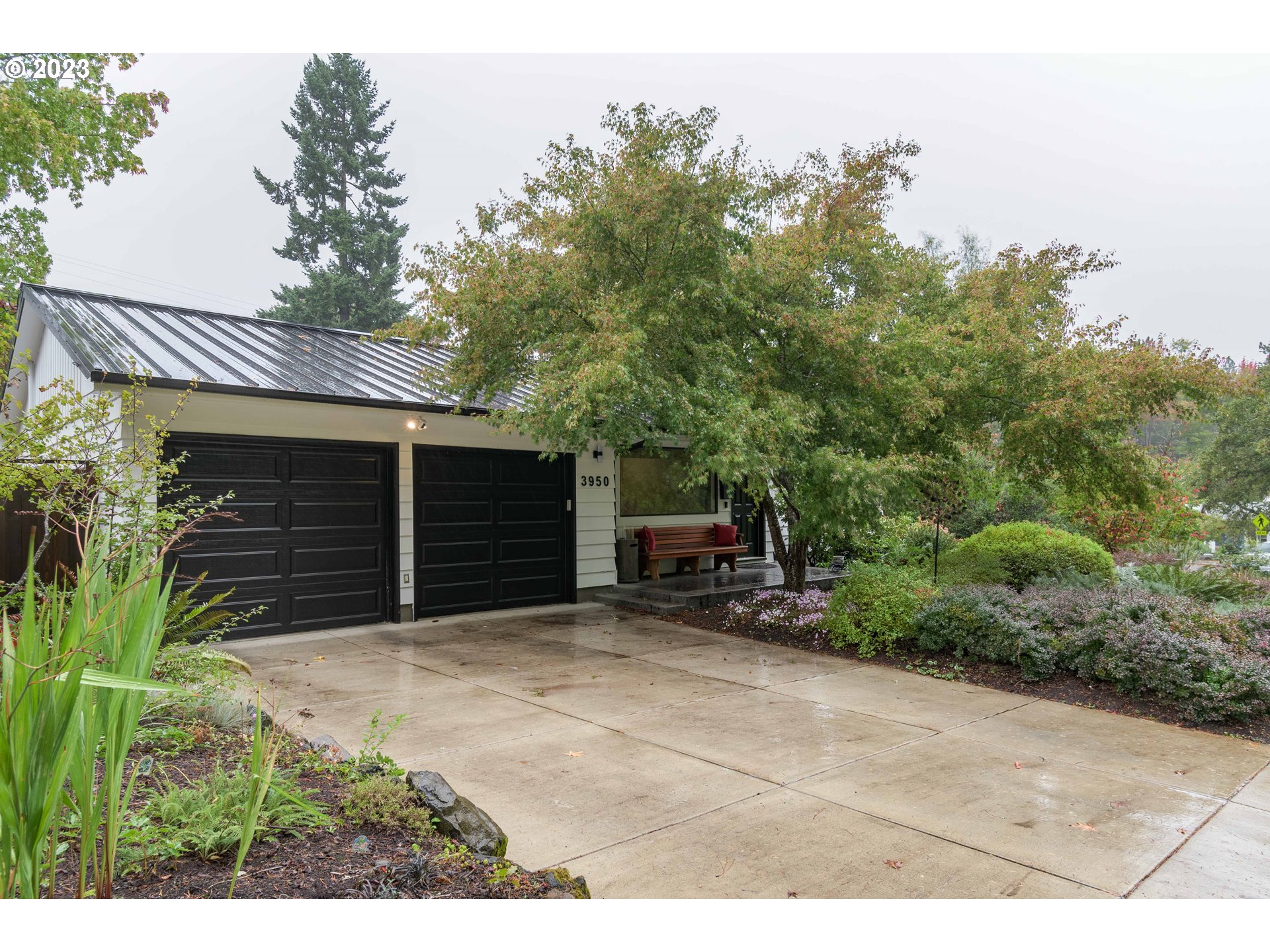 Nestled in the highly sought after South Hills area, this 3 bed/2 bath home delivers on both comfort and convenience. The days of summer will have you relaxing in the lush, fully-fenced backyard with well established blueberry bushes ripe for picking and brightly colored flowers in abundance. At the end of the day, you can choose to relax in the hot tub under the stars or cozy up in front of the fireplace. The robust integrity of this home has recently been reinforced with a new metal roof installed in 2022 which provides the home with both energy efficiency and long term viability, and foundation work by RamJack West which includes the installation of six helical piers (transferable warranty option). Some of Eugene's top rated schools, Edgewood Shopping Center, and Tugman Park are all within casual walking distance. The home has a long list of up-to-date amenities which include: central heat/air paired with a nest thermostat and a highly rated Merv 16 Air filtration system, original hardwood maple floors throughout, automatic irrigation system, high efficiency heat pump, 200 amp service generator connection, Ring doorbell, new solid core interior doors, induction cook top, built in microwave with vent, and black out power blinds for primary bedroom, plus more. The ample two car garage space includes a Tesla charger and a smart garage door opener. LG tower washer/dryer is included in the sale. Owner made all the right updates to ensure this home provides lasting fulfillment. Make it yours!