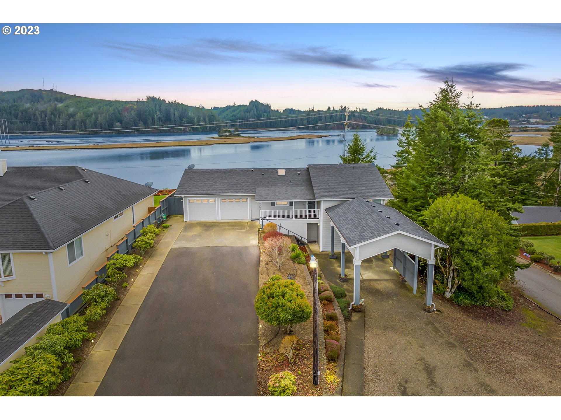 Majestic Siuslaw river views can be seen from nearly every room in this gloriously remodeled custom home. Open living area with luxury vinyl and beautfully updated kitchen. Solarium off of living room. Main floor primary room with walk-in closet, bathroom with Luxstone roll in showers. Spa room with half bath. Lower level family room with two additional bedrooms and full bath. Accessibility with front door ramp, chairlift. Deck and gazebo as well as covered porch. RV carport and hookups.