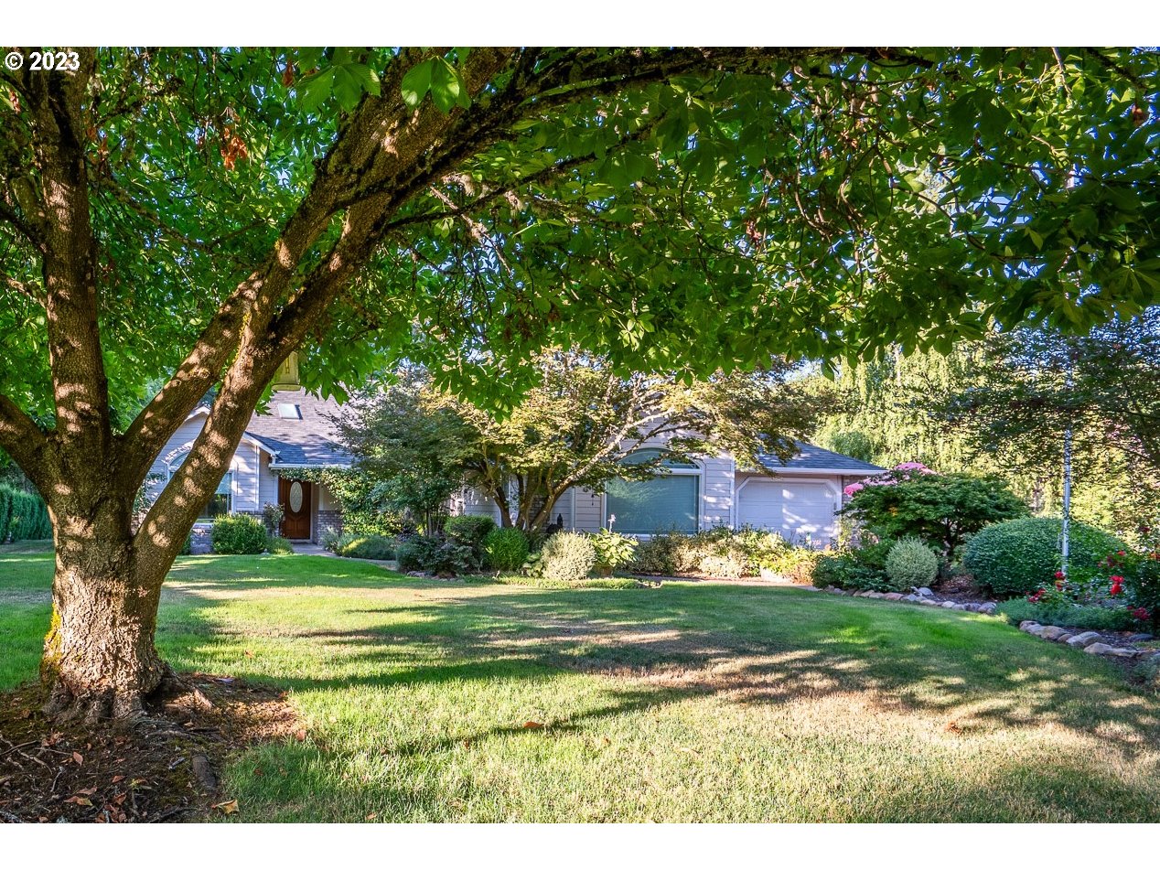 This beautiful Pleasant Hill home situated on two breathtaking landscaped acres has so much to offer. Over 4000 square feet of modern one-level ranch-style home. Enter through the beautiful wood and beveled glass front entry, into the foyer, which is the center compass for the entire well-designed home. To your left is a dining room designed for extended family and friends gatherings. Straight ahead to the kitchen with stainless steel appliances, breakfast nook (with slider to the deck and backyard,) and living room with built-in overhead display shelves and vaulted ceilings. To the right, your primary suite boasts a walk-in closet, shower, and separate tub. All bedrooms are generously sized, and a bonus room offers a separate entrance to the side patio. The picturesque park-like grounds offer a 1000 sq ft trex deck in the backyard and a patio off the primary suite with an 8-person hot tub that can be included in the sale. Also, a whimsical yet practical 14x12 garden shed fully powered with lights and outlets, and a charming gazebo in yet another portion of this beautifully landscaped yard. This property has 2 water wells, one has a manual hand-drawn pump. The other is new in 2010   and connects to a water filtration system. Extensive underground Rainbird-Toro irrigation system. 2022 new roof, heat pump, furnace, and airflow handling unit. New flooring, interior paint, and LED lighting throughout most of the home. Along with two attached garages on the main house, there are two separate drop-stair attic storage spaces.A detached 2400 sq ft garage hosts two 12 ft doors and one 14 ft door built for enclosed RV parking, and an RV electrical outlet. The garage is 40 ft deep, with Commercial Grade shelving. Included is a finished 1200 sq ft lofted apartment with a separate entrance, separate electric, water, and sewer. Behind the garage is a half-acre that is completely fenced with a mini barn and water supply for animals. Extra exterior EV charging station and parking.
