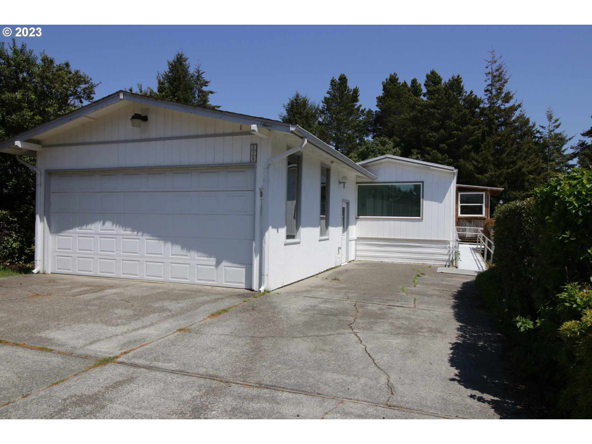1600 RHODODENDRON DR 228 Florence, Oregon Enjoy the active, 55+ community of Grentrees Village. This spacious home has a site built addition which includes a large family room, bonus room, 3/4 bath, and storage room. Landscaping of native vegetation provides privacy and low maintenance. The primary bedroom features a sitting room with slider to the back yard. The interior is light and bright with numerous skylights and solar tubes. The home has been well maintained and is move-in-ready.