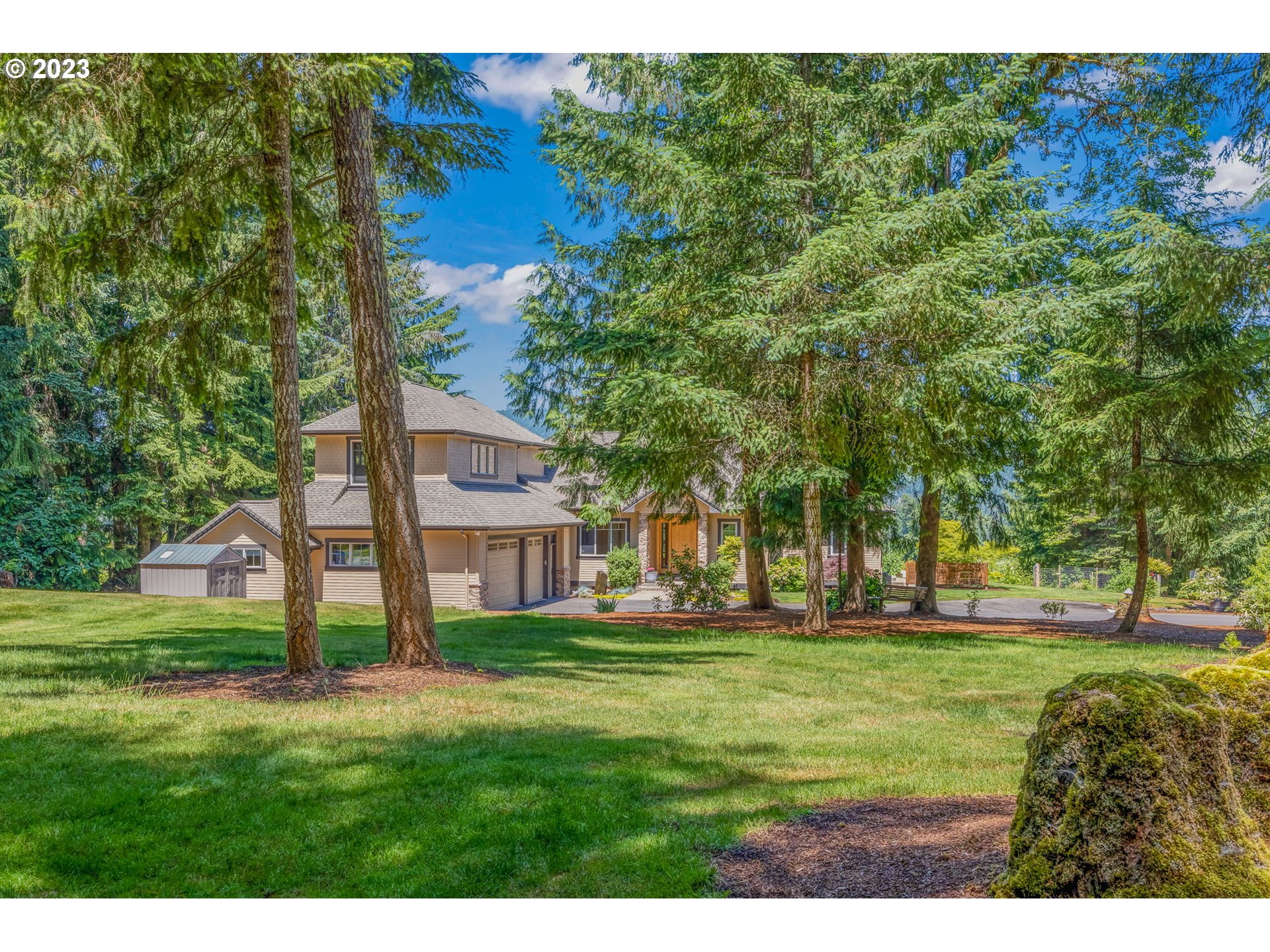 Escape the city and say yes to living in the heart of the PNW! Only 10 minutes from town, you will find this custom-built gated home on 6.7 acres. Surround yourself with the majestic mountains, McKenzie River views, abundant forest land, and landscaped park-like setting. The grand entrance leads to an open floor plan with a gourmet kitchen, a large cook island, granite counters, and a walk-in pantry. The living room offers stunning floor-to-ceiling windows, a soaring beamed ceiling, and a fireplace with surrounding built-ins. The main level offers a dedicated office and two primary en suites, each featuring large stone-tiled walk-in showers, dual vanities, granite, and spacious walk-in closets. For separation of space, head upstairs for an additional bedroom, full bath, and an oversized bonus room/family room or workout room. The primary en suite offers exterior doors leading to the backyard and a wonderful hot tub, the perfect way to start your day or watch the fantastic sunsets. This property also offers an oversized 3-car garage and plenty of additional parking for RV, boats, and friends. Enjoy the deer-protected raised garden beds, grape and kiwi lines along the lower fence, and a variety of fruit trees, including apple, pear, fig, pear, plum, cherry, hazelnut, goji berry, mulberry, and walnut. Take advantage of the tire staircase east of the backyard by the fire pit, which will lead to your personal trail system thoughtfully designed to access a secluded waterfall. This home offers everything you have been looking for and will not last long. Schedule your showing today to experience what living in the PNW is all about!