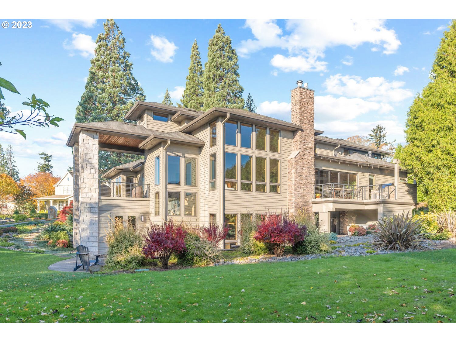 Custom built luxury stunner in the heart of Lake Oswego's sought-after Forest Highlands neighborhood with Mt Hood views, entire entertainer's floor with spa, billiards hall, home theater, elegant full bar, pickleball/sport court and offering wonderful privacy! Enter to a statement great room with every imaginable amenity from soaring 14-20' ceilings, floor to ceiling windows, radiant floor heat, fine stone and millwork, sleek contemporary lines, and fabulous indoor-to-outdoor sun room with fireplace for year round enjoyment. The holiday-ready dining room and polished gourmet kitchen feature luxe built-in features and cabinetry plus built-in espresso machine, desk, and cook's seating island. Enjoy true main level living in the sumptuous primary suite with spa bathroom, sunken tub, and vast dressing room. The main level study/library features a pass-through Mt Hood view and dual remote work stations. Upstairs find a beautifully appointed guest bedroom suite, two bedrooms sharing a jack and jill bathroom, and a full guest or in-laws suite with bedroom, bathroom, private balcony, kitchen, and nearby elevator shaft to the garage. Fitness studio, wine cellar, poker room, and an epic sound system with destination covered patio and view decks check all the boxes and then some in this magical property. The immaculate grounds offer a full sport court, fire pit, and motor court with collector's 4 car extended garages. This Masterfully built refuge near top Lake Oswego Schools, championship golf, New Seasons Market cafes, and shopping is the consummate in the executive living and ideally situated on .65 acres in Portland's most desirable suburb!