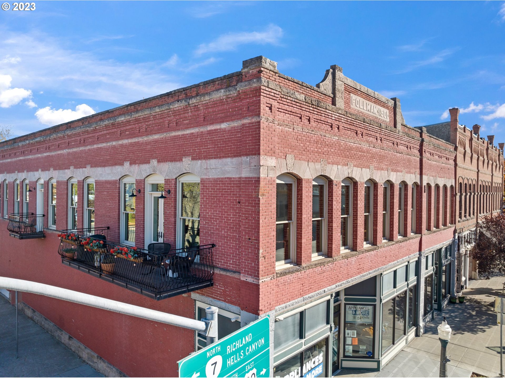 Discover the perfect blend of historical charm and modern luxury in this captivating condominium located at 2030 Main Street, #201, in the heart of Baker City, Oregon. Offering 2,670 square feet of living space, this 3-bedroom, 2-bath residence is a masterpiece of architectural design and thoughtful renovations.Step into a world where original woodwork and doors, transom windows, and vintage-inspired mother of pearl push-button light switches blend seamlessly with contemporary comforts. The result is a timeless living space that celebrates the best of both eras.The heart of this home is undoubtedly the custom kitchen, a culinary enthusiast's dream. It boasts a dual-fuel 6-burner gas range, a KitchenAid dishwasher, built-in Frigidaire Gallery separate refrigerator and freezer units with an ice maker, and a stunning quartz countertop. The hickory and dover white wooden cabinets, crafted by local artisan Boman Cabinets, feature crown molding and trim for that extra touch of elegance.You'll love the spacious den/office/library with built-in bookshelves, large 4x8 JELD-WEN wood windows, and exposed original brick exterior walls. A private outdoor balcony spanning approximately 7x24 feet invites you to enjoy parades, bicycle races, and all Main Street events from the comfort of your own home. The balcony features Trex decking, a power outlet, and custom French doors by Anderson, creating an oasis of tranquility in the midst of the city.Conveniently located within walking distance to restaurants, a movie theatre, shopping, Sweet Wife Bakery downstairs, and Bella Gourmet Market across the street, this condominium offers the ideal urban lifestyle.With a secure building and second-floor living space, you can enjoy peace of mind whether you're at home or away. Experience the charm and convenience of downtown living with this exquisite condominium. Don't miss your chance to call this historic gem your new home!