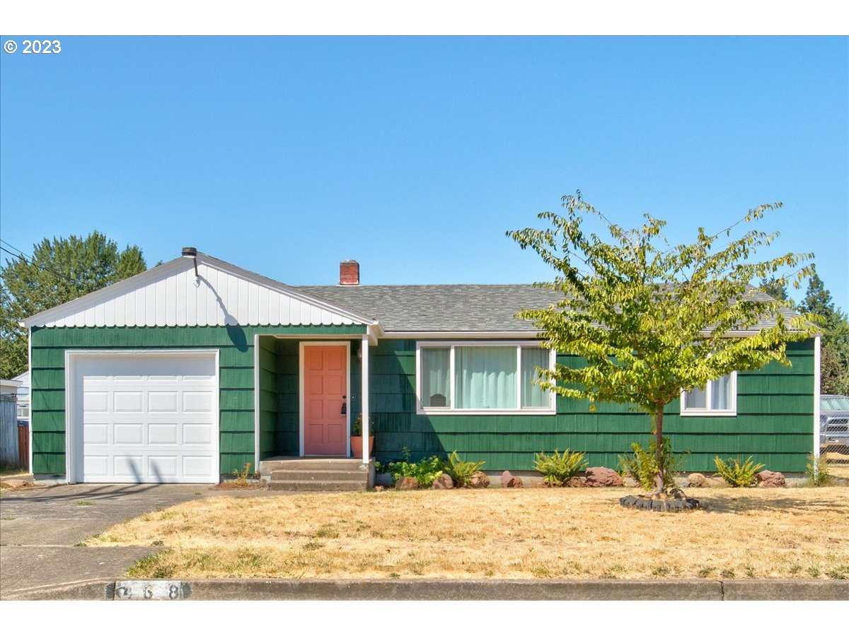 Come see this cozy and charming home with room for your hobbies and toys as well! Home features new exterior paint, vinyl windows, built-ins, large laundry room and hardwood floors throughout. Exterior has a separate shop, space for RV parking, and a chicken coop all in additional to a very large flat yard space.  So much potential with this property yet still convenient and close to all the amenities of town.