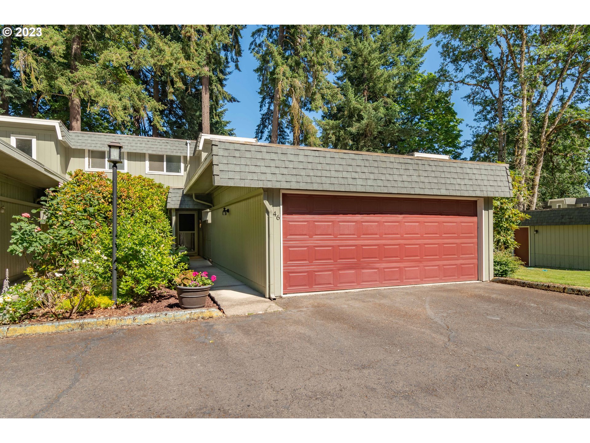 Welcome to this move-in-ready 2-story 3 bed, 2/1 bath townhome in coveted Ferry Street Bridge.  A peaceful retreat with nature's calming background symphonies. The outside world comes inside with picturesque views of established trees. Follow the sun or hide in the shade, with daylight pouring into the home at different times of the day. As you enter the home, the living room flows into the dining room while sliders from both rooms beckon you outside onto the private fenced-in deck. The half bath on the main floor is there for your guests. Follow the hall into the kitchen and the chef in you will delight with the newer induction top range. Grab your beverage of choice and step out from the kitchen sliding door onto your second private fenced-in deck. The roomy primary bedroom ensuite has a balcony for you to enjoy your morning coffee and the park-like setting. It also features a walk-in closet giving you the much-needed storage space one requires. The detached two-car garage has additional ample storage, with two large built-in closets and a workbench for your tools. The HOA covers pool, exterior maintenance, clubhouse, landscaping, and water/sewer/garbage. Great central location to shops, restaurants, parks, and golf course.