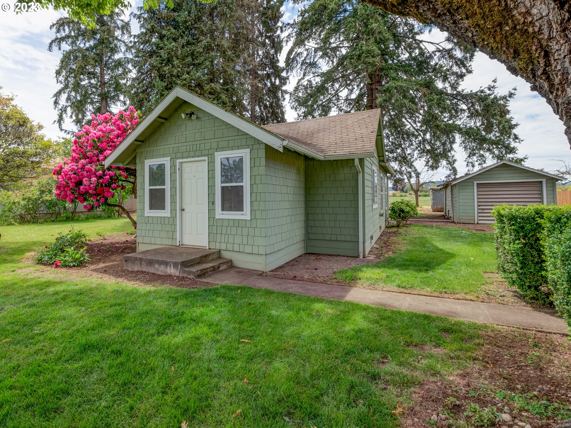 This property is situated in the historical township of Alvadore, established in 1914 a quiet small community atmosphere with quick access to the towns of Eugene, Junction City as well as Fern Ridge Lake and the Eugene Airport  This rare property with 3 bedrooms (without conventional closets)  1 bath  and a garage garage has fresh paint and carpet.  The kitchen has a built in hutch  Floors are  mostly wood under carpet. Recent survey and septic System.  LOW TAXES! RV parking.