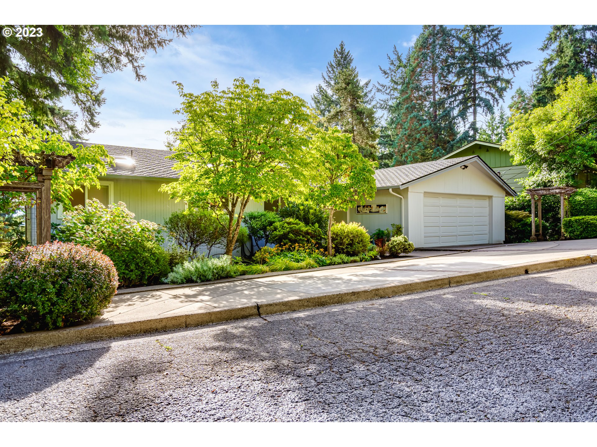 2555 BIRCH LN Eugene, Oregon Wonderful mid-century home in the Fairmount area, only houses away from the rhododendron gardens at Hendricks Park. This beautiful home features immaculate hardwood floors on the main floor and abundant natural light flowing from skylights and large windows. The inviting front room features one of two wood burning fireplaces with views to a natural yard setting. The Prime Bedroom on the main floor is next to the main level bath which features a walk-in shower and Jacuzzi tub. The lower level features Bedrooms 3 and 4, a large family room, and large exercise/hobby room. The exterior yard is its own nature garden with mature landscape, beautiful inlaid brick patio, and fabulous multilayered deck and walkway. Please look at the spectacular virtual tour.