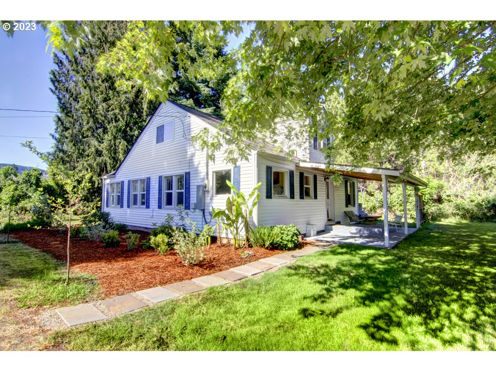 Stunning 1-acre live, work and grow property. A rare opportunity to live and work in peace and seclusion only 8 minutes from all the amenities of town. You are surrounded by all that the McKenzie Valley has to offer. Picturesque forests, the serene Walterville Canal with the Walterville Canal Birding Trail steps away from your front door. This move-in ready home has been updated with quartz counters, beautiful refinished ash hardwood floors, new renovated bathroom, new vinyl windows, ductless heating/cooling, new wood-burning stove, new paint inside and out. The 1300 sqft shop/barn is set up for a multitude of uses with versatile rooms for woodwork, hobbies and additional living spaces. The commercial food processing area was inspected and approved by the Oregon Department of Agriculture. In addition, there is living space that has been used as a guest quarters with full bath, bedroom and compact kitchenette. The space has lovely high wood ceilings and a modern feel. Perfect for an office or visitors. This entire structure is serviced by its own dedicated septic tank and has a convenient RV sewer dump station. Don't miss your chance to own this remarkable property!