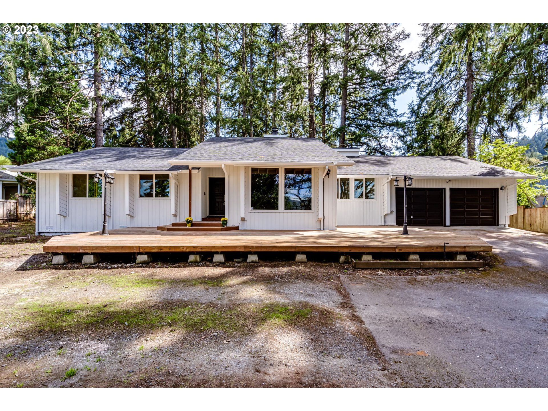 Located on a large private lot this home has been exquisitely updated by House 2 Home Construction. This property boasts a great layout with vaulted ceilings and a large fireplace featuring cedar paneling. The kitchen is brand new with a butcherblock countertop island, and features all new stainless steel appliances. Both bathrooms are oversized and the house is all one level for easy access. There is an oversized deck in the front of the house for entertaining, and a large covered porch in the backyard to stay dry in the winter. This property has ample parking and a 2 car garage as well for extra storage. In proximity to the Thurston Nature Center for biking and hiking. Open House Sat 5/13 1-3pm