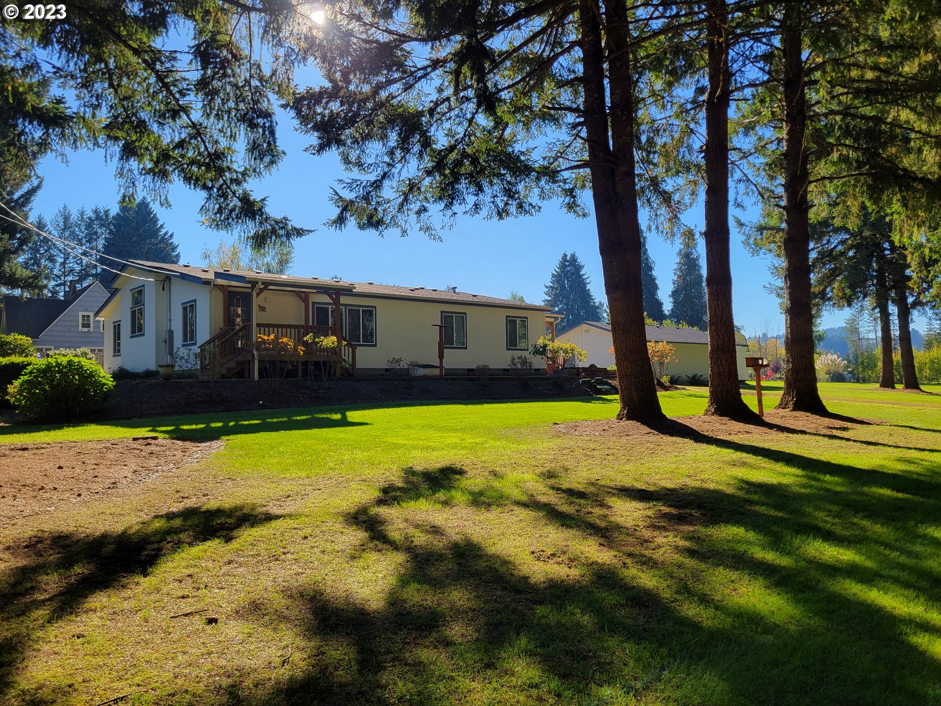 Close-in park like acreage with meticulously maintained '01 manufactured home. 2080' home with 3 bedrooms and 2 bathrooms. Open floorplan to kitchen dining and living room, and separate family room for added space. Vaulted ceilings throughout the home. Primary bedroom offers massive bathroom with soaker tub and walk-in shower. 3 covered decks for entertaining year round. Outside storage in the oversized 24x36 2 car garage with storage/tool room and additional 12x16 storage shed. 2 acres of mixed field and timber with beautiful landscaping. Garden area with blueberries, strawberries, and blackberries. Second driveway could offer potential for a shop or ADU? Buyer to verify with county.