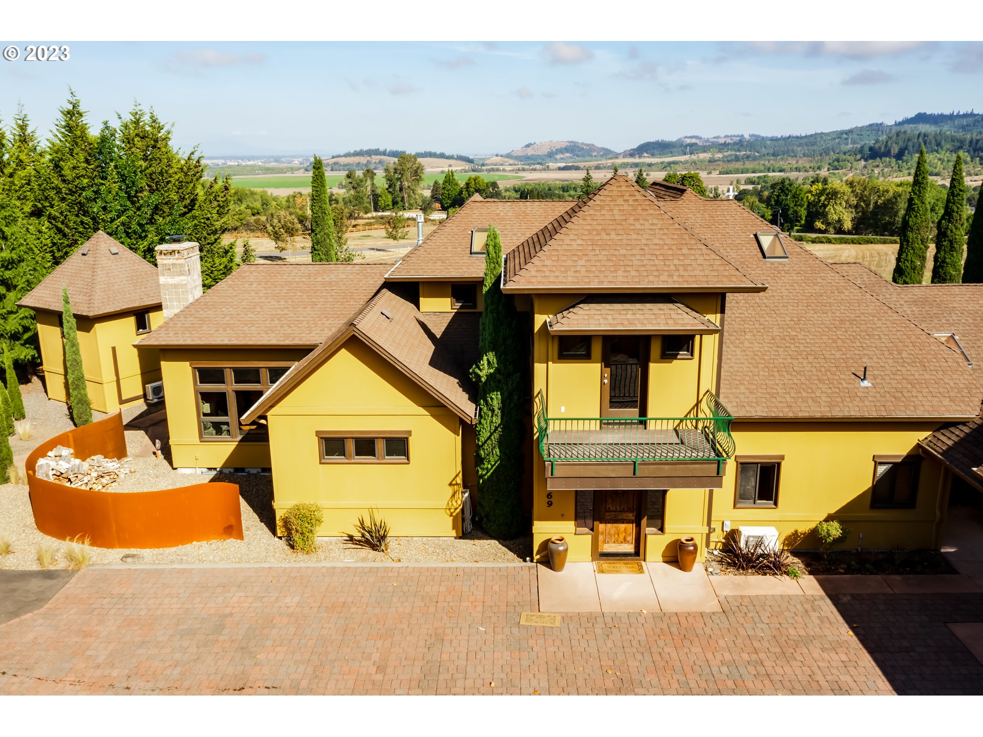 90869 Coburghills DR Eugene, Oregon Life in the Coburg Hills is special. Close to town but private, quiet, and luxurious. Enter through your wrought iron gate into your 10-acre estate. Mature landscaping surrounds this Tuscan-inspired home. From the cobblestone courtyard to the heated pine floors, this home charms at every turn. Plenty of space for hobbies and guests with a large main home and 2 separate guest quarters. The gourmet kitchen is sure to delight with unparalleled views, new granite countertops, chef grade appliances, and large pantry. In addition to the oversized garage, there is a shop with storage loft, and a separate studio that would be a perfect gym/art space/craft room, etc. The tall ceilings, custom touches throughout and spacious feel make this home one of a kind. Owners are licensed real estate agents. This home is a must see!