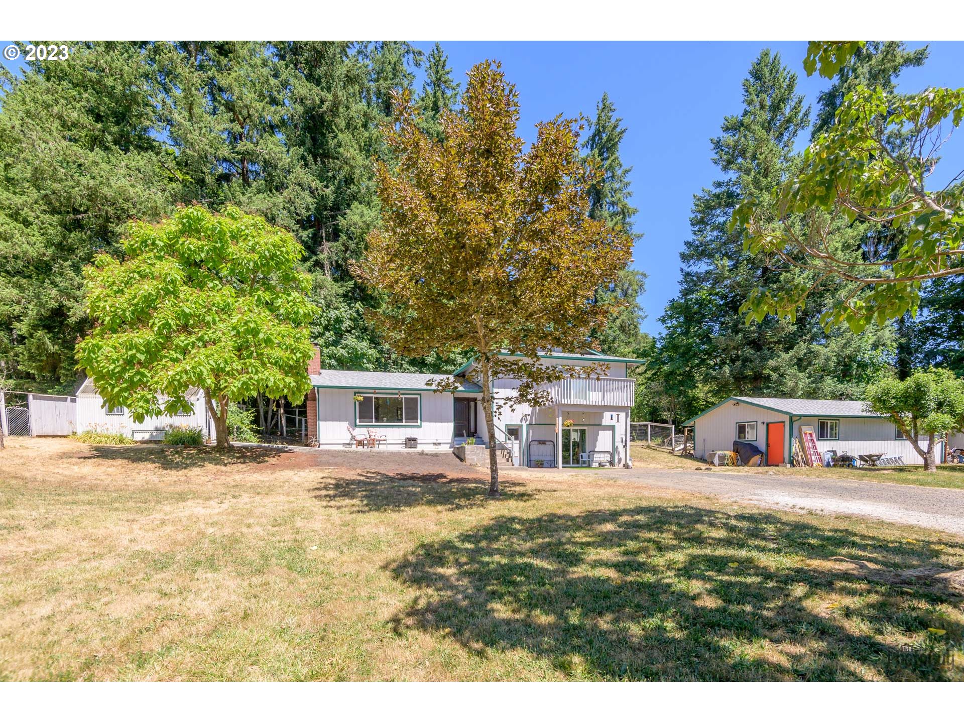 Beautiful, gently sloping 5 acres just 1/2 mile from Fall Creek Reservoir, surrounded by amazing treeline. The lower level family room now has a full bath and cozy pellet stove. The living room includes a wood fireplace. All windows and sliders have been replaced in this home 2023, 3rd bathroom now a full bath, home has a hard wired generator for backup power. Starlink in. This property is all set up for animals with a two-stall barn storage, hay storage area, fenced/cross fenced pastures, electric fence ready. Pastures and fencing in great condition. The finished shop has potential to be ADU (buyer to verify), currently has power, green house, large chicken coop and deer fenced garden area. OPEN SUNDAY 08/13 1:00-4:00 P.M. Seller is offering a $5000.00 concession towards buyers closing costs or rate buy down. Come see this amazing property.