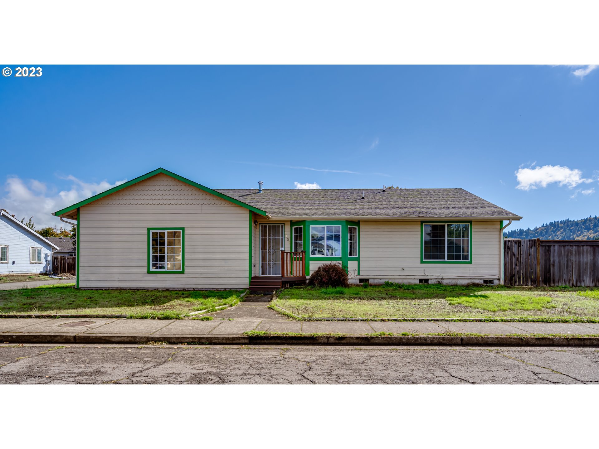 1150 N 16TH ST Cottage Grove, Oregon One story updated home on a corner lot in a centrally located quiet neighborhood. The home opens to a spacious living room with vaulted ceilings and a gas fireplace. The living room leads to a remodeled kitchen with granite countertops and dining area while three bedrooms plus a den provides great access to the privacy. The house is bright and welcomes natural light. New flooring throughout. There is a gate on the side leading to the paved RV parking. The backyard is easy maintained, and it backs to a large green space.