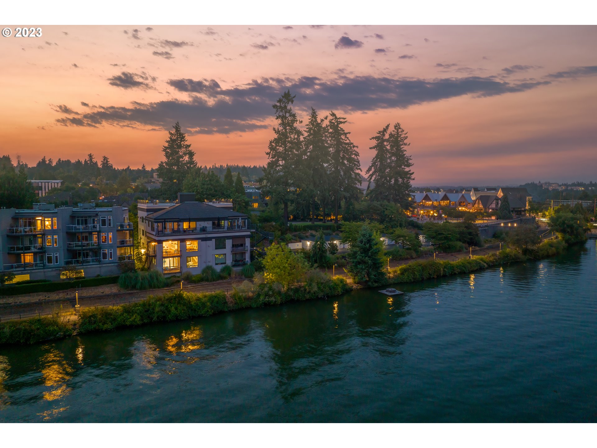Live in the heart of Lake Oswego's Lakewood Bay in this waterfront condo nestled in a building steeped in the city's history. Once a power plant that eventually became an apartment building and is now home to five units of waterfront condos, this home features incredible views from almost every room. Completely reimagined by Portland's renowned Phil Chek as his personal residence, this double-unit home with 10' ceilings blends historical elements with all the modern conveniences for effortlessly casual luxury living. Secure, direct elevator access to this three-level home where Chek's signature attention to detail has created light-filled spaces perfect for entertaining and gathering with friends and family.