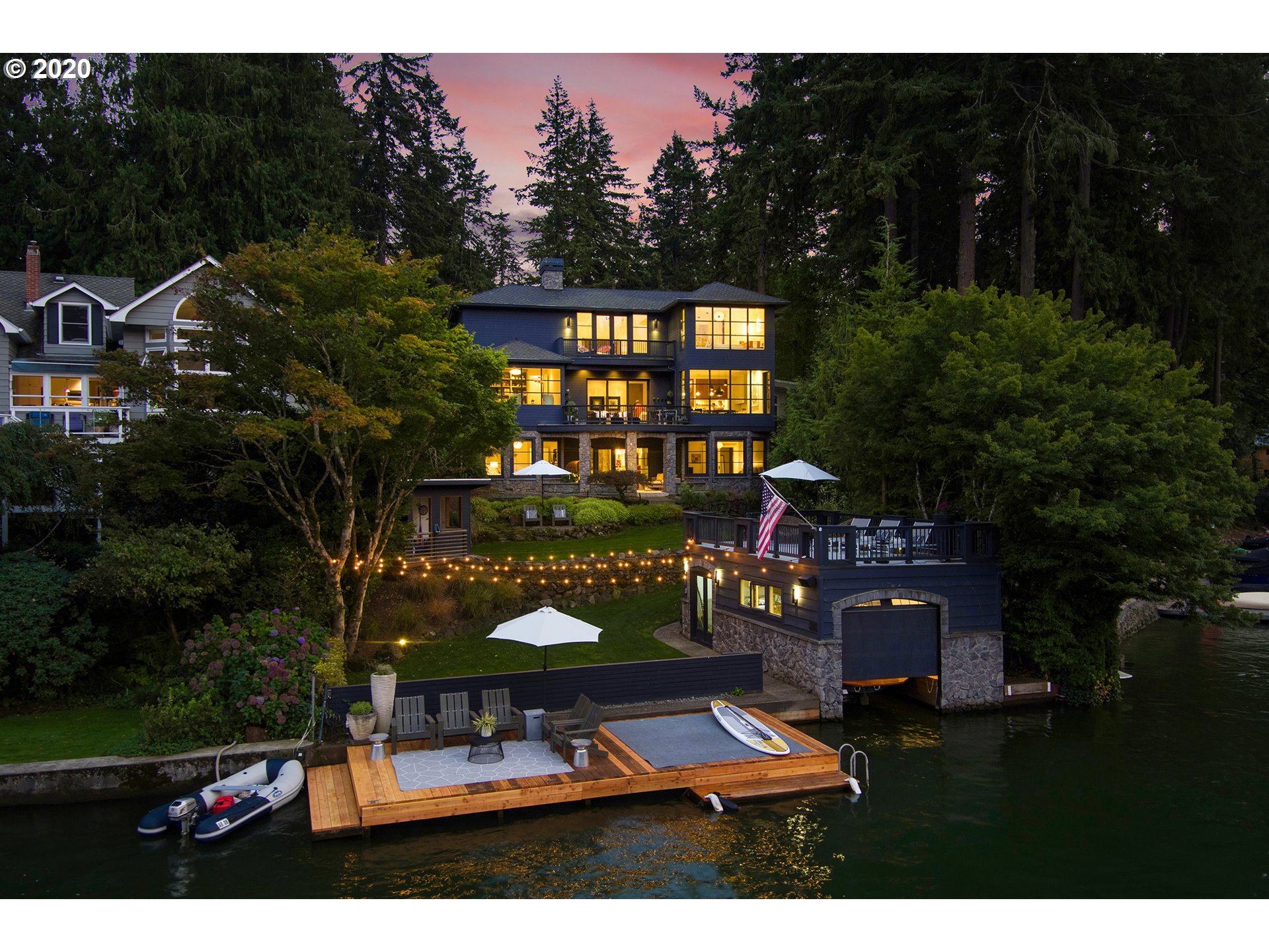 This lakefront home is truly a modern metamorphosis. Completely reimagined in 2014, it defines approachable luxury. Open flow on all 3 levels for indoor/outdoor livability. Carefully curated palette & impeccable finishes-walnut, marble & glass. Lush grounds, pvt dock & boathouse w/ lift. Lake views from every rm are your personal modern art. Designer lighting, gmt kit w/ lrg island, lrg sliding pocket glass doors, walnut flrs & custom details thru-out. All the best that lake life has to offer!
