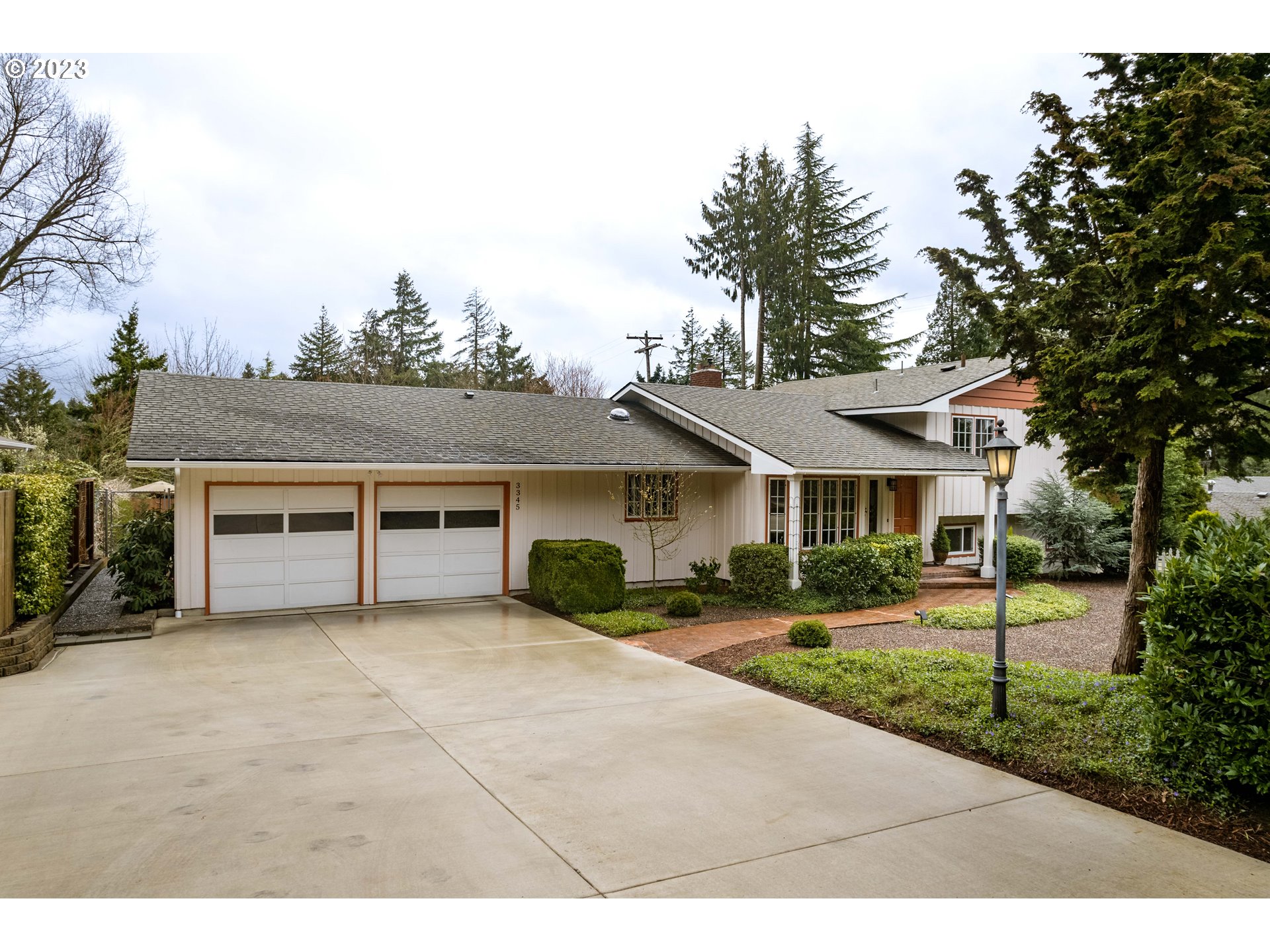 Still looking for that 4-bedroom, light-filled, South Eugene property with tons of upgrades? Welcome to Your New Home! Move-in ready with hardwood floors, walls of windows, formal and informal living areas, and fantastic separation of space. Spacious remodeled kitchen with sunny breakfast nook, granite counters, ample storage & stainless appliances included. Main living/dining room features cozy pellet stove and views of the private backyard. Huge family room with wood-burning fireplace opens to a huge covered patio. Tucked away primary bedroom with additional bedroom makes for a private owner's wing. Beautifully remodeled bathrooms with tile showers and free-standing soaking tub. Surprisingly quiet, sunny & lush yard featuring drip irrigation, large garden bed, flowering bulbs, established shrubs, fruit-bearing blueberries and strawberries, and multiple serene gathering areas that are perfect for gardening, relaxing & entertaining. Home also features brand new driveway, newer paint inside and out, 4-head ductless heat pump system, all vinyl windows, updated lighting and hardware, oversized 2-car garage and more. Incredibly clean and meticulously maintained...call your agent to view!