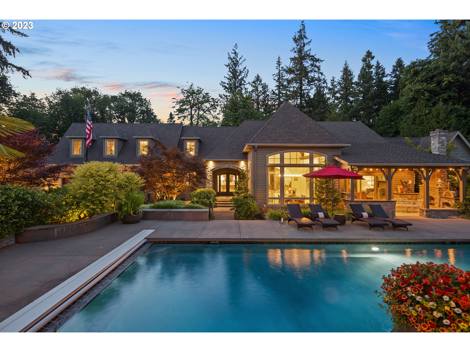 One of Lake Oswego area's most spectacularly secluded vacation where you live estates! This gated 1.88-acre property with an epic pool and pool house, a layout created for entertaining indoors and out, and luxurious finishes throughout. Designed by Curt Olson, principal of Olson Group Architects and built by John Tercek's Stoneridge Custom Development, this very private estate borders a 6.8-acre nature park with five miles of trails in the Forest Highlands neighborhood. The pool house features a great entertaining space including a DJ stage, a kitchenette/bar and a home office/studio as well as 1.5 baths, laundry room and a vaulted oversized two-car garage. The casually elegant home has a fantastic layout with the primary suite on the main floor and a split design of the second floor creating a private guest suite separate from four additional bedrooms, library, theater room, and a home gym. Soaring ceilings highlighted by thick, wooden beams and huge windows flood spacious rooms with natural light. Oversized three-car attached garage and an RV pad.