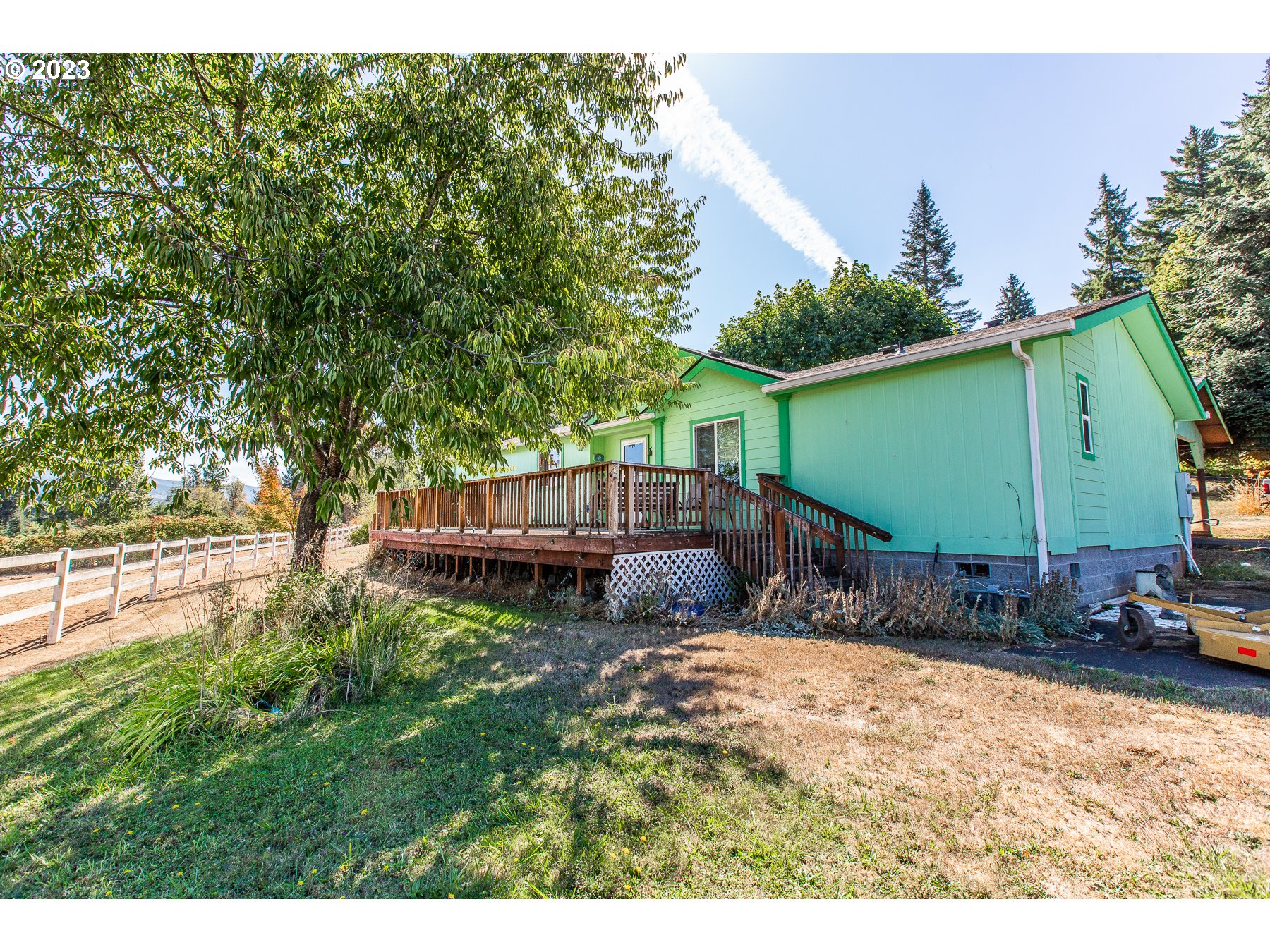 This home features over 11 acres of land, with maturing timber in one corner, fenced horse pasture with barn, stalls, arena, corral, grazing area, and tack room in the next. There is a large separate shop, detached rec room, storage shed and work area! There is an abundance of wildlife including deer, turkey and quail. The home features vaulted ceilings, an open floor plan, office/4th bedroom, cozy wood stove, large kitchen with island and pantry. There is a large primary suite with double closets, large bathroom with dual vanity and walk in shower. The potential with this property is ENDLESS! Enjoy the beautiful views of the surrounding mountains from the front deck. Eat fresh fruit from the trees, and make this land your very own!! This home is move in ready and waiting for you!