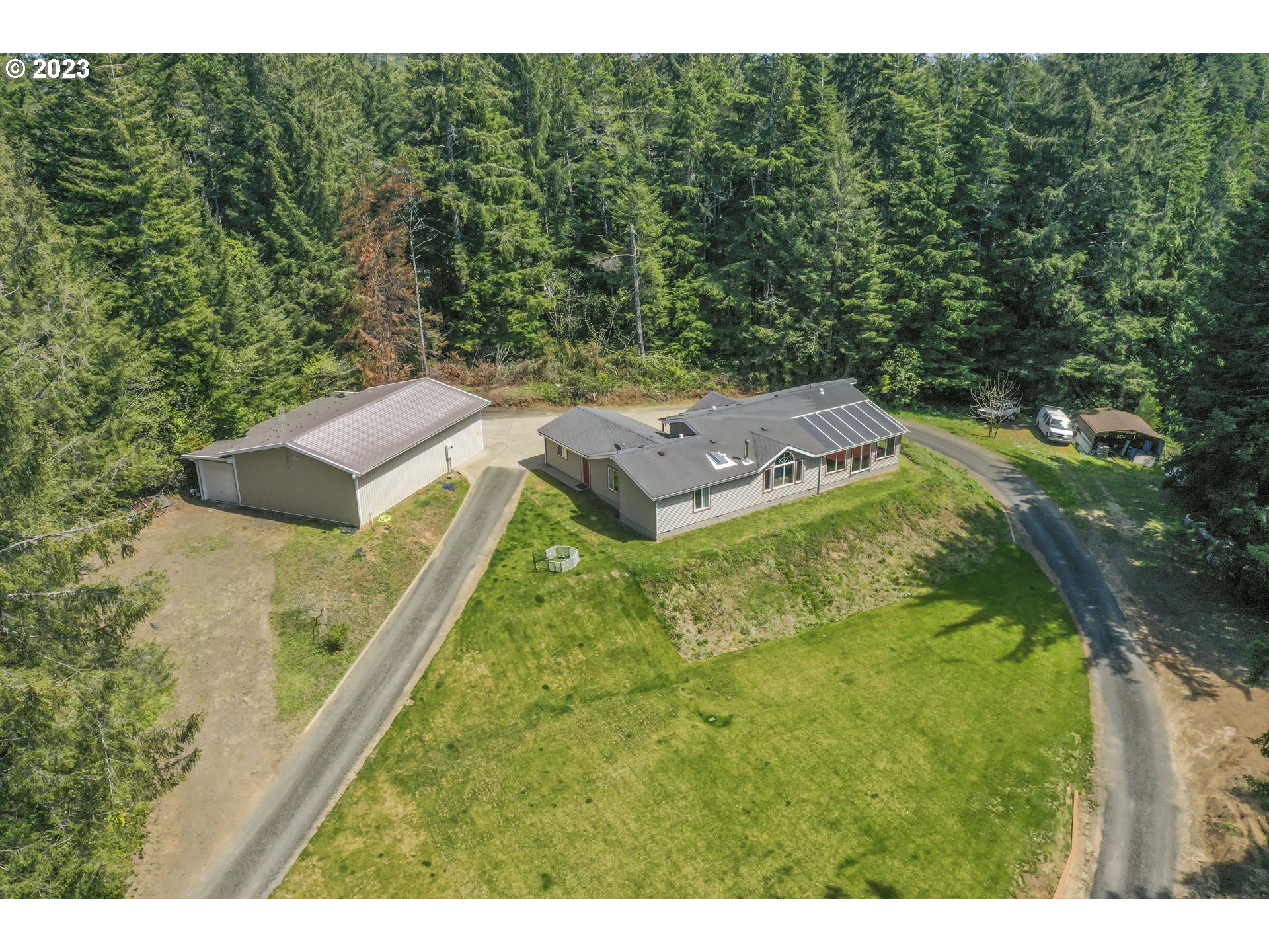 5024 Alder DR Florence, Oregon Don't miss this well-maintained 3 bedroom, 2 bathroom home on just over 2 acres of land located just South of Florence! This home features tile flooring, vaulted ceilings & large windows throughout, bringing in plenty of natural light. Enjoy the large primary bedroom with a walk-in closet, changing area and attached bathroom with heated floors, double sinks, soaking tub & walk-in shower. Convenient open floorplan. Kitchen features custom knotty alder cabinets with lots of storage space, SS appliances, double ovens, granite counter tops & island with eat area. Living room features wood stove, ceiling fan & sliding glass door leading to the swim spa room. Main bathroom has been fully remodelled and brings in natural lighting with skylight. Laundry room leads into the attached oversized 2-car garage. Property also includes an oversized RV garage with attached workshop plus 2 carports. Easy access to all buildings on property with the circle driveway. Schedule your showing today!