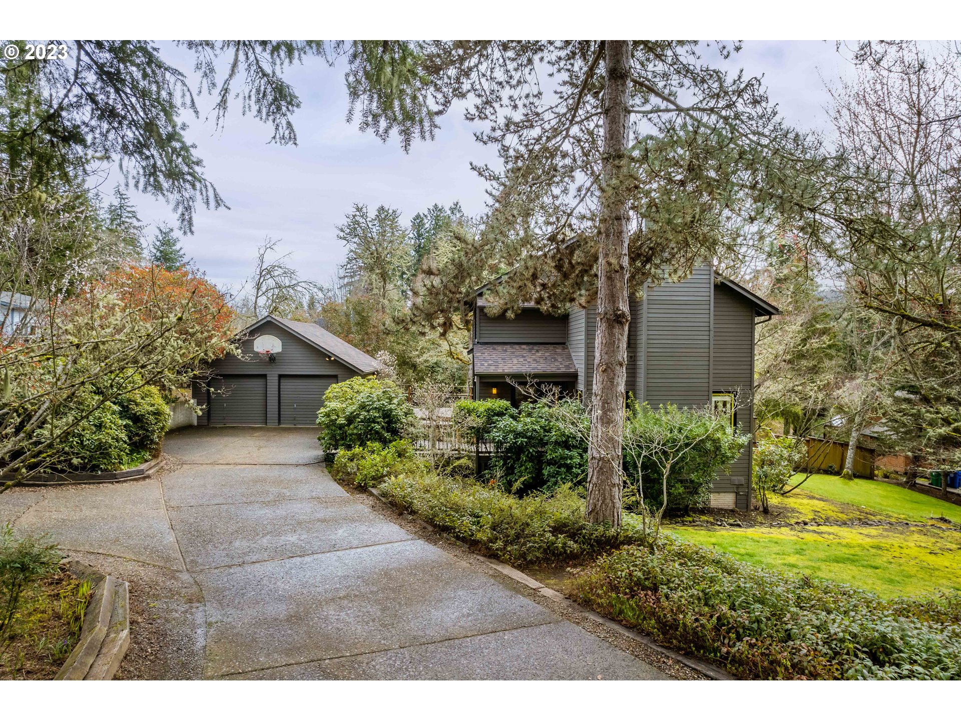 Stylishly Custom NW Contemporary in Ultra-Private SW Hills Cul-De-Sac on .41 Acre Lot! Well-designed floor plan with wood accents, cool architectural details, hardwood floors, high ceilings and skylights. The living and dining areas exude warmth and the numerous windows allow you to appreciate the tranquil setting. The updated kitchen with stainless appliances opens to a sunny family room. Vaulted primary ensuite features a fireplace & all 3 bathrooms have been remodeled. French doors lead to wrap around deck, abundant outdoor areas & entertaining spaces, fenced backyard and garden area, beautifully landscaped front yard, sweet courtyard, and fruit trees. Brand new roof, heat pump offering central heat & air, oversized detached garage and plenty of parking!