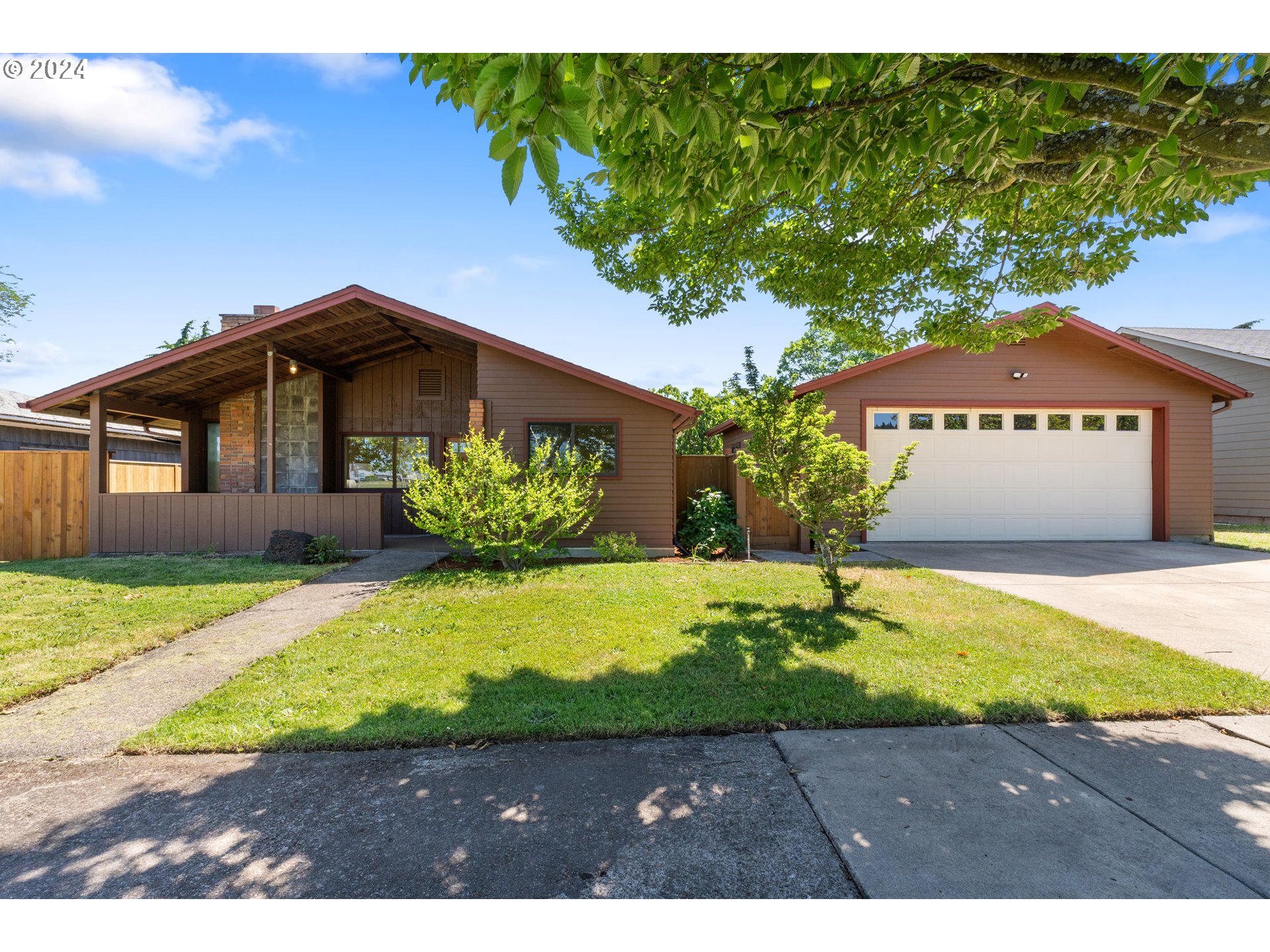 Welcome to the loveliest Friendly Neighborhood remodel. Light and bright inside, nearly every surface has been redone with modern touches. Custom kitchen with beautiful cabinets and all new appliances. Thoughtful details throughout, such as built-in hallway cabinets, a ceiling mounted mini split system, and cozy radiant heated floors in the bathrooms, hallway, kitchen, and dining room. This sunny property has a detached 465 sq ft shop AND a oversized detached garage, a wall-to-wall deck, and walkways that connect it all, making for a great back drop to the fully fenced-in back yard. In the yard, you'll also find plum, cherry, and fig trees, and raised garden boxes. In the front, don't miss the Shishigashira Japanese maple tree! The shop has an 100 amp sub panel with multiple 110v and 220v circuits, vinyl floors, and is 100% ready for your hobbies, storage, or work space. The detached 576 square foot garage has an electric sub panel and is wired for a 50 amp car charging circuit. The property is situated across the street from a large greenbelt that includes parks, schools, trails, a disc golf course, tennis/pickle ball courts. It is also very convenient to multiple stores and restaurants. The views across the greenbelt to the SW Hills are stunning too; sunsets are spectacular! The Friendly St neighborhood home you've been dreaming of is ready for you. See it all at our upcoming open houses or make an appointment for a private showing.