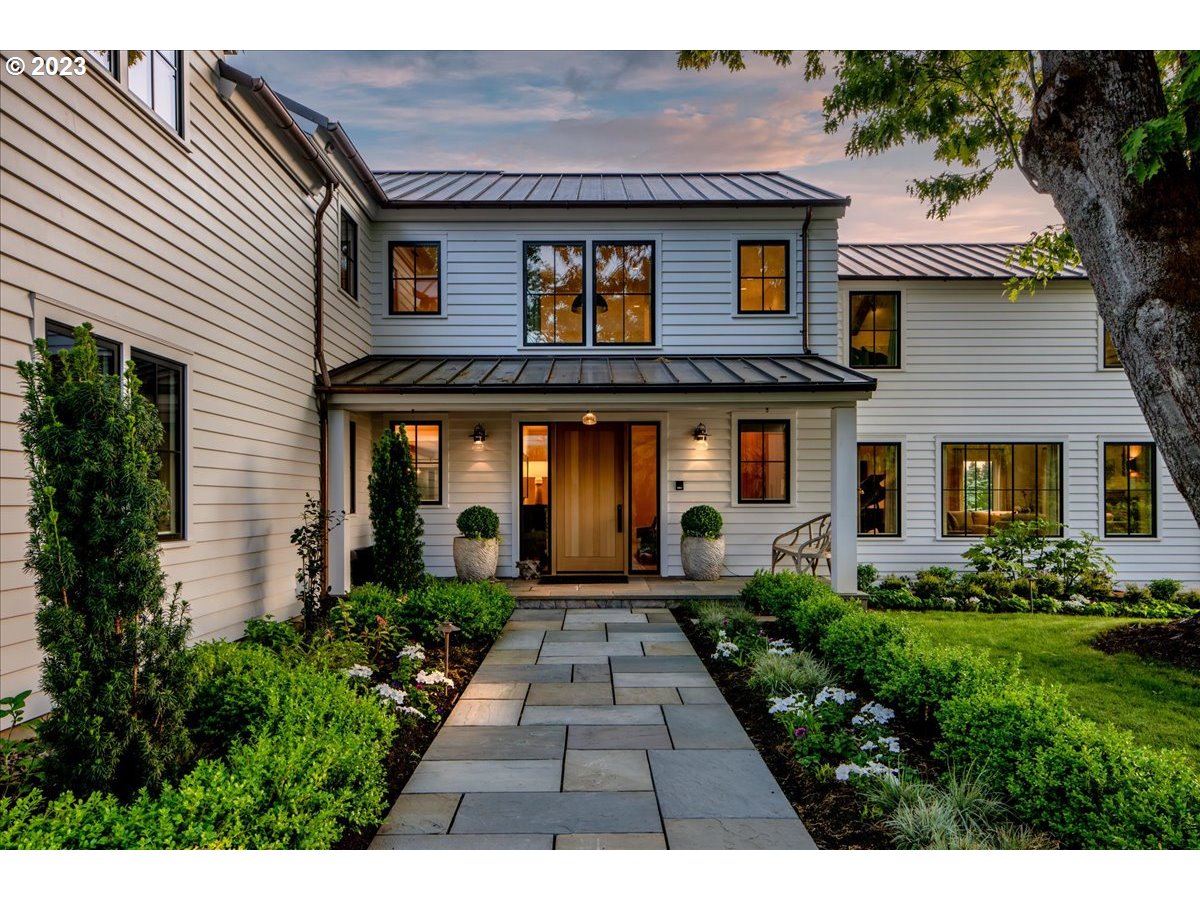 4401 SW GREENLEAF DR Portland, Oregon Indulge in unparalleled luxury with this meticulously crafted 5-bedroom, 5.5-bath estate in exclusive Green Hills neighborhood. Completed by Green Gables, this sun-drenched home, set on over an acre of private grounds, offers a blend of privacy and exclusivity. Interior designer Lisa Staton and Emerick Architects collaborated on the breathtaking design, infusing modern elegance with timeless sophistication. This sprawling 7400+ sqft home showcases a desired floor plan with a secluded primary suite with tranquil spa-like bath, two laundry rooms, library, wine cellar, and home gym. Beamed ceilings and giant picture windows frame the stunning, lush grounds, flooding the living spaces with natural light. A generously sized gourmet kitchen with top-tier appliances, walk-in butler's pantry, wet bar, and large island, all contribute to this architectural masterpiece. Every detail is a testament to impeccable craftsmanship, encapsulating modern farmhouse elegance. Whether you're relaxing in the comfort of the interior living spaces or enjoying the outdoors in the mature landscaped gardens and outdoor entertaining areas, this home offers a serene and luxurious retreat.
