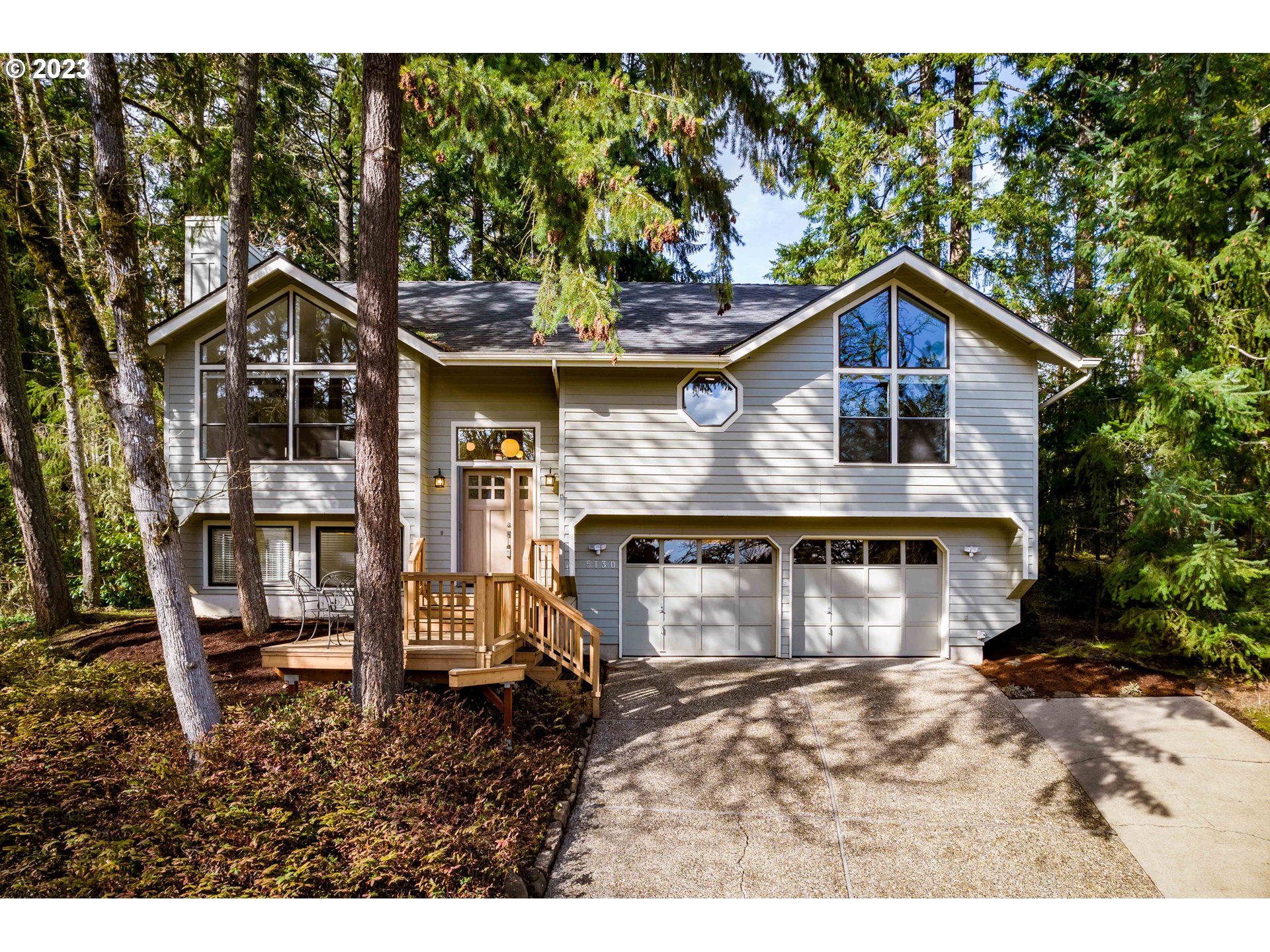 Don't Miss this Stylish & Modern Home in SE Eugene Cul-de-sac! Open concept design w/ huge windows, vaulted beam ceilings, wood fireplace, LVP floors, remod kitchen w/ island, quartz counters & newer cabs. Vaulted primary ensuite w/ custom closet & tile shower. Great separation of space & 3 full baths, all updated. Enjoy the NW w/ tree views in your natural yard w/ decks in front & back, tool shed, extra deep garage. Central heat/air + newer roof, water heater & ext paint.