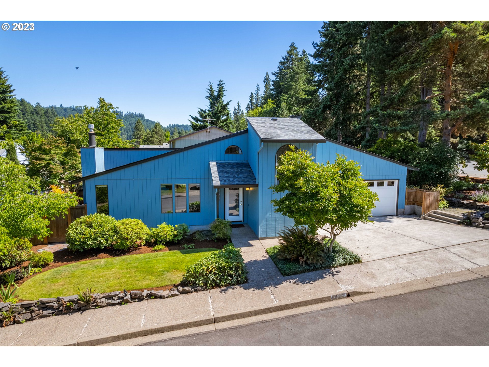 Cool Custom Contemporary in Premier Southeast Eugene Location! Back on the market due to no fault of the home or seller (change in buyer situation)...amazing opportunity for you. A dream for gardening and entertaining, the generously sized & light-filled living spaces wrap around and have access to a secluded central courtyard. Remodeled kitchen with custom bamboo cabinetry, granite countertops, pantry and eating bar serves as the center part of the home. Enjoy the gorgeous setting from the living room (featuring a gas fireplace insert) and adjacent formal dining room. The main level owner's suite with updated bathroom features more glass doors leading to the courtyard. Two additional bedrooms and another remodeled bathroom on the main level plus a sun-bathed loft upstairs with vaulted ceilings, double venting skylights, storage nooks and sink has endless possibilities as an art studio, media room and more! The large and private, fully-fenced backyard has a deck with built-in bench seating. The mature landscaping, lush foliage, flowering bulbs, underground sprinklers and water feature add to the relaxation and enjoyment. Brand new roof, central heat and air, 2-car garage, recent inspection on file, excellent condition overall. All this in a sweet neighborhood community with very little traffic, close to schools, shops, parks and trails...welcome home!