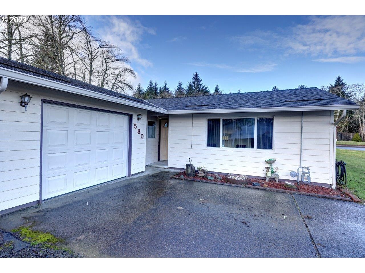 580 SW 1st ST Warrenton, Oregon Location! 4 bdrm, 2 bath house. Clean & Move IN ready. 50 year warranty roof installed 5 years ago, new gutters & skylight, new gas furnace installed 3 years ago. Primary bdrm connects to adjoining bdrm offering a perfect home office or nursery room. Updated kitchen, quality cabinets & corian countertops. Tall carport located next to the garage for RV or boat storage. LARGE fenced yard, for kids & pets! This will not last long!