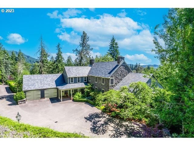 Rare offering - Camas Manor, rich in style & grace, this private Colonial 50-acre estate is just minutes from downtown Eugene. Secluded amidst pristine Oregon forest are expansive lawn areas, multiple patios, rock walls, exquisite English gardens, 2 miles of manicured trails & vast views to the coastal ranges. Artisan period finishes include hand-forged steel latches & fixtures, hand silk-screened wall covering, hand carved ceiling beams, rare red Indonesian marble counters & Yellow Pine flooring salvaged from a 1690 Colonial. Stylish living areas include 4 fireplaces, multiple main living spaces, formal dining, chef's kitchen, breakfast room, office, parlor, entertaining room, multiple bonus rooms, guest suite & sleeping quarters. 12kw solar array produces most energy. Event parking for 28 vehicles. 4-stall barn with heated tack room & hay trolley. Covered RV parking. ATV trail. Pond, waterfall feature & natural spring. Extensive upgrades, visit website at 771w52ndave.com for full in