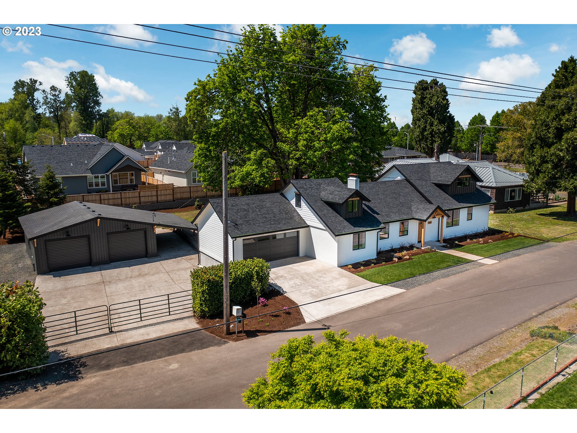 1050 KINTZLEY AVE Springfield, Oregon Almost entirely new construction and infrastructure (well, septic + power service all new), designer home with premium high-end finishes, ~1/2 acre lot, large detached shop with added storage, all in town and close to bike paths & recreation! Some highlights include bedrooms and living areas on the main level, skybridge walkway extending from the office to the huge bonus room or 5th bedroom flex space. Efficient new ductless system and high R-Value insulation combined with low county taxes and SUB utilities provide for a comfortable and affordable environment. Outside, endless entertaining opportunities are accompanied by a beautiful big-leaf maple legacy tree. A rare find and too much to list, be sure and ask your Realtor for the Listing Packet!