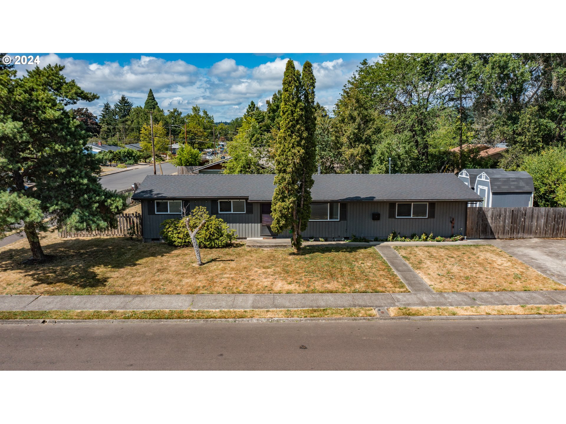 Welcome home to this move-in ready single-story home with a huge backyard and lots of updates. Enjoy this ranch style home on a corner lot in a quiet neighborhood, blocks away from shopping and restaurants. Entertain in the large 0.22 acre backyard that includes fruit trees, 2 covered patios, 2 large sheds on cement foundations, and plenty of room for play. The attached shop offers endless possibilities for projects and storage. Updates include new double pane vinyl windows, water heater, and microwave. Schedule your showing today!