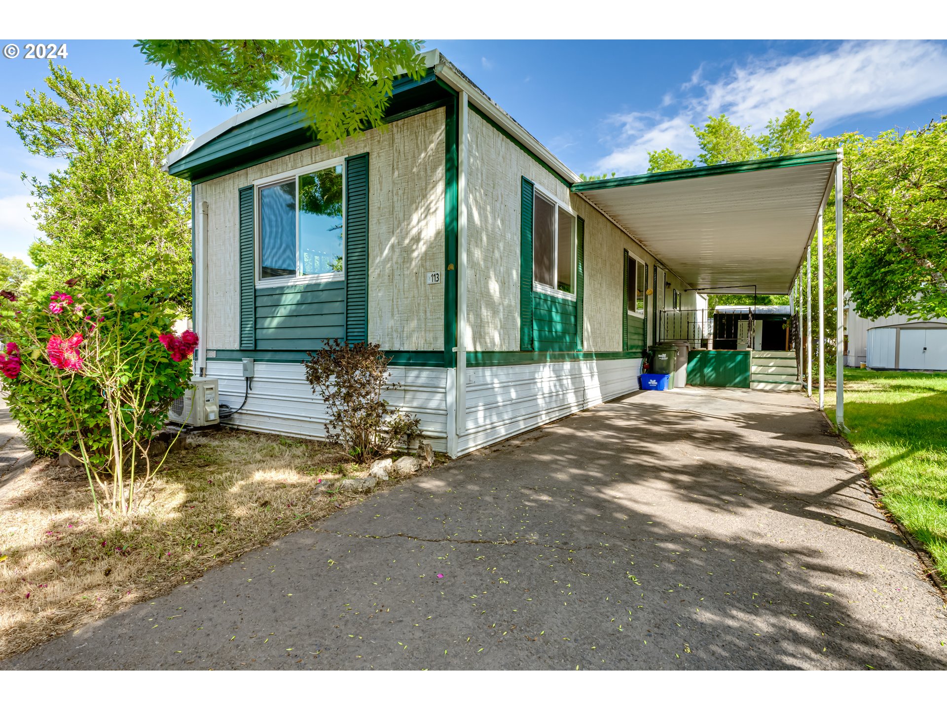 Falcon Wood Village MFH home located on the LTD bus line and near shopping and restaurants. Upgrades in the home include: ductless HP, newer refrigerator and vinyl windows. Large living room and eating area with built-ins. Washer and dryer stays! The park amenities include a library, post office, pool, hot tub/spa, community building, billiards and a car washing station.  Buyer approval by park is required prior to closing. 55+ Community Space Rent $995 monthly.