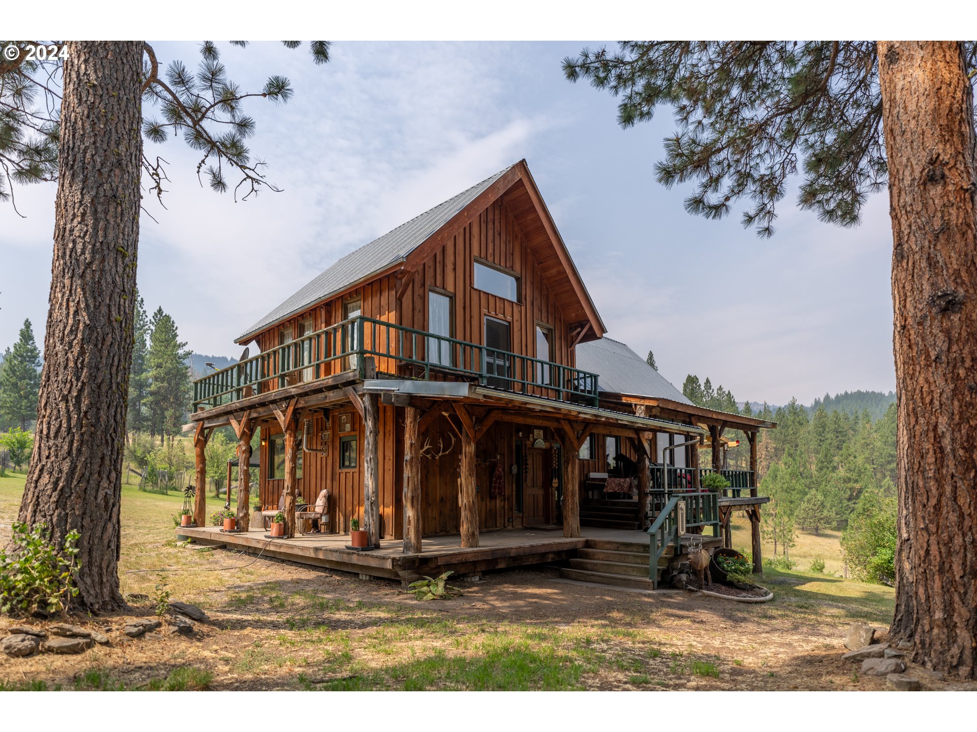 Discover ultimate privacy at this end-of-the-road sanctuary, offering 196 acres of secluded, off-grid living. Nestled within the property is a stunning 1,932 sq. ft. timber frame home, blending rustic charm with modern comforts. The estate also has an impressive 3,000 sq. ft. barn with tack room, workshop stalls and corral. A brand-new heated garage/shop, making it ideal for equestrian enthusiasts or hobbyists. Perched on the breaks of the Middle Fork of the John day River, the land is a picturesque mix of timber and pasture, offering breathtaking viewsWater is abundant here, with a spring-fed system, a 1,500-gallon cistern, and 2 acres of water rights from creek. A new solar system installed in 2020, a greenhouse, garden and an orchard provide for sustainable living. Stay connected while enjoying the serenity, as high-speed internet and reliable cell service are available. Year-round access is guaranteed on a county-maintained road, making it convenient and accessible.Located in the Northside hunt unit, this property is a hunter's paradise with landowner tags available. Embrace the tranquil lifestyle you've always dreamed of in this unique, self-sufficient retreat.