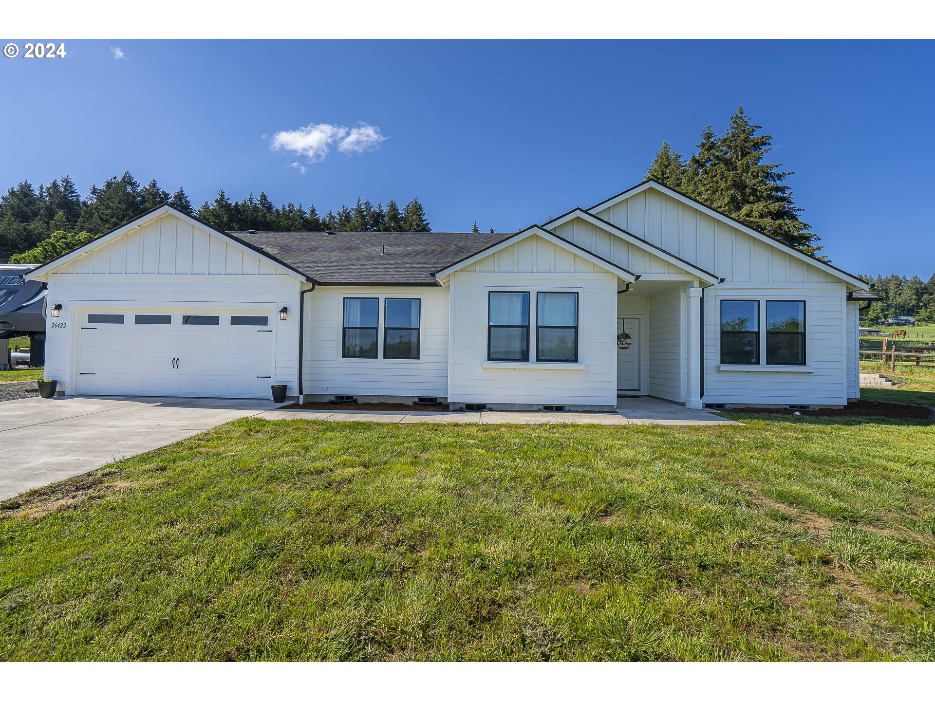 This stunning home offers the perfect blend of modern design and spacious country comfort. Situated on a generous 1.59-acre lot just 10 minutes to JC and 20 minutes Eugene. This single-story oasis boasts a vaulted ceilings, large primary suite, oversize garage, gated entry, and circle driveway for easy access for trailers. Step inside and be greeted by the luxurious ambiance of this 2022 construction. The open-concept layout seamlessly connects the living/dining to the a chef's kitchen featuring quartz countertops, pantry, gas range, custom herringbone tile backsplash, and eat-in-bar, creating an ideal space for entertaining  and friends. Featuring 3 bedrooms PLUS office and two bathrooms, this home provides plenty of room for everyone to enjoy their own privacy. The custom tile work throughout adds a touch of elegance and sophistication to every corner. With a generous 2097 ft.² of living space, this single-story home offers vaulted ceilings in the living room and primary suite that create an airy and spacious atmosphere. The large primary bedroom and bathroom provide a tranquil retreat, complete with a custom tile shower, large walk-in closet, and walk-in shower for ultimate relaxation. But the features don't stop there. This exceptional property also includes RV parking with power, circle driveway, solar ready, and ample well GPM. To ensure year-round comfort, this home is equipped with a high efficacy heat pump with AC. No matter the season, you'll be able to enjoy the perfect temperature inside with the gas fireplace featuring herringbone tile surround. This beautiful modern home on 1.59 acres offers a wealth of amenities and thoughtful design elements that make it truly exceptional. Don't miss the opportunity to make this dream home yours and experience the epitome of comfortable living.Open House Saturday 6/29 11-2pm