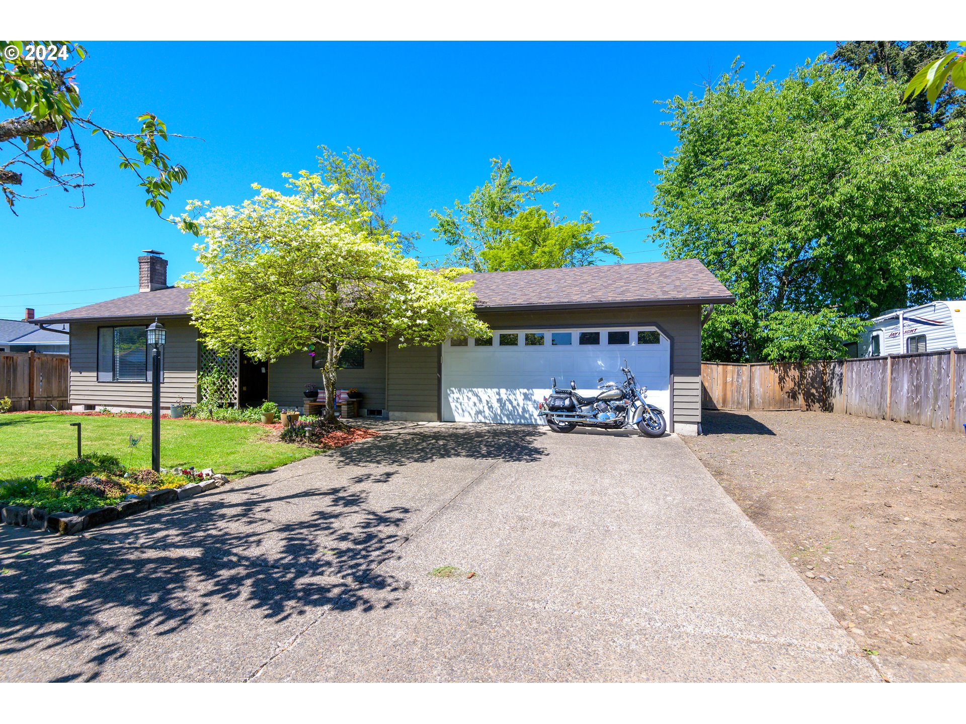If you are looking for a single level, remodeled home be sure to make an appointment to view this one! This home has had a lot of updates including a spectacular kitchen remodel with granite counters and stainless-steel appliances. Vinyl Plank flooring throughout the home is both waterproof and easy to maintain. The dining room opens onto the back, private deck, to enjoy the large, fenced backyard, with treehouse and plenty of shade. Beautiful light and vaulted ceilings round out this incredibly charming home that is packed with value & style. 14x47 RV Parking. Motocycle is excluded from sale.