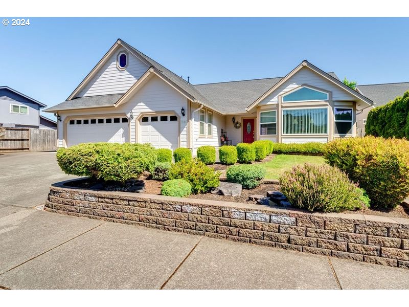 Gorgeous one level home in one of Cottage Grove finest neighborhoods. Beautifully designed with generous windows for natural light, including bay windows in both breakfast nook and living room. Vaulted and high ceiling throughout the rest of the home make for a spacious living. The well laid out kitchen boasts of updated appliances including smart double ovens. Large primary suite with walk-in closet and ample space for additional furniture beyond the King bed. Beautifully mature landscaping includes an inground irrigation system, and a delightful back deck for entertaining guests, complete with gas line for BBQing. The 3 car garage is fully finished with 3rd bay separated for workout equipment, motorcycles, craft room etc. This home has so much to offer. It is a must see with tons of extras.