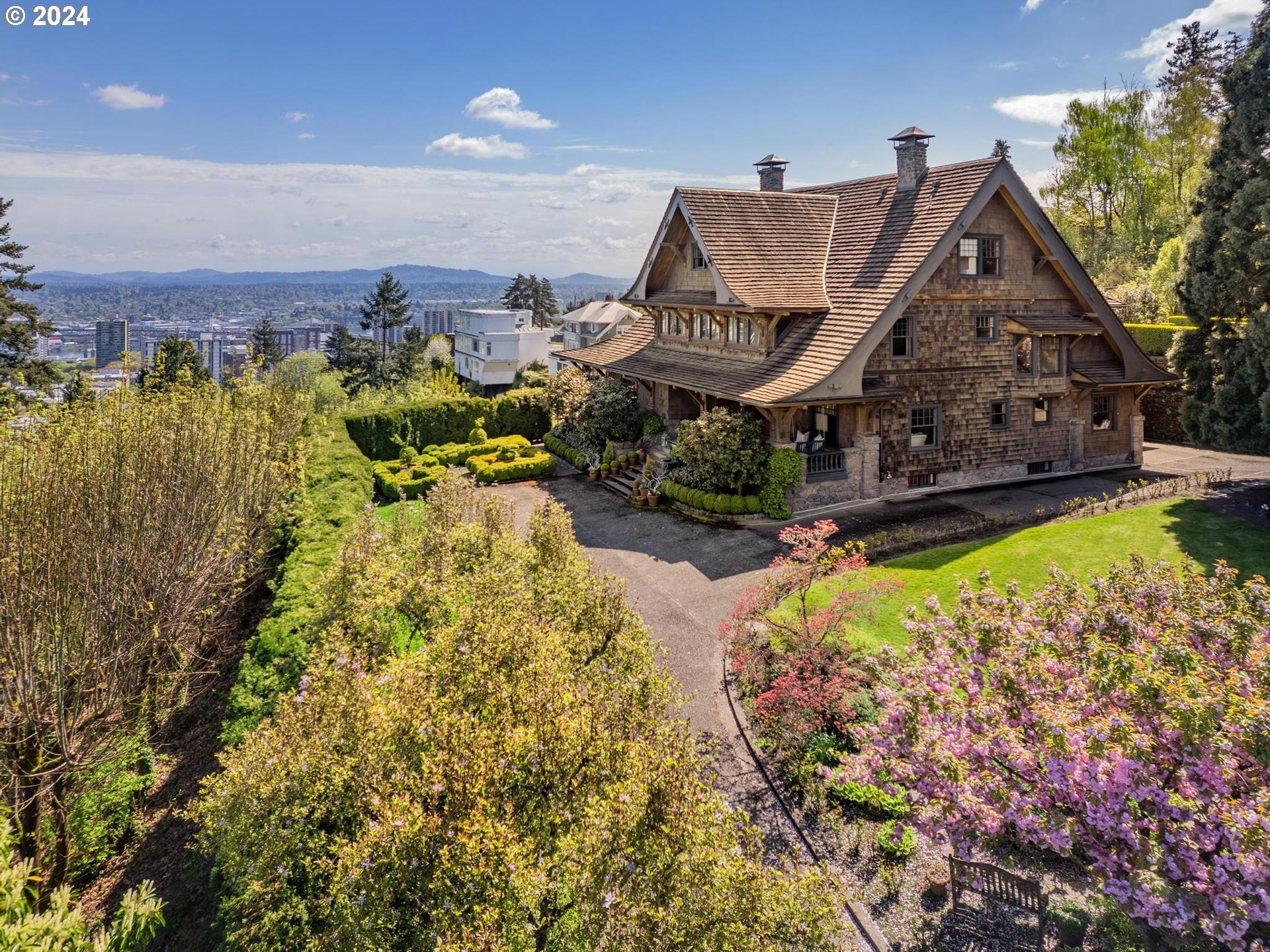 Step into the rich history and luxury of the Joseph Gaston House, an architectural masterpiece built in 1911 by William C. Knighton in Portland's West Hills. This captivating estate offers a timeless allure with its elegant living spaces, and impeccable craftsmanship. Perched on 3/4 of an acre in The Grid, it commands panoramic views of the city skyline and mountains, creating an idyllic backdrop for everyday living. Features include intricate moldings, high ceilings, stunning primary bedroom with walk-in closet and spacious bathroom with steam shower, and remarkable 5,000-bottle cellar. Outside, a beautiful patio overlooks downtown Portland, providing a serene retreat to unwind and take in the scenery. Extensively remodeled in the early 2000s, including full replacement of plumbing, and electrical. From its historic charm to modern amenities, the Joseph Gaston House epitomizes sophistication and elegance, offering a rare opportunity to own a piece of Portland's architectural legacy. [Home Energy Score = 1. HES Report at https://rpt.greenbuildingregistry.com/hes/OR10227560]