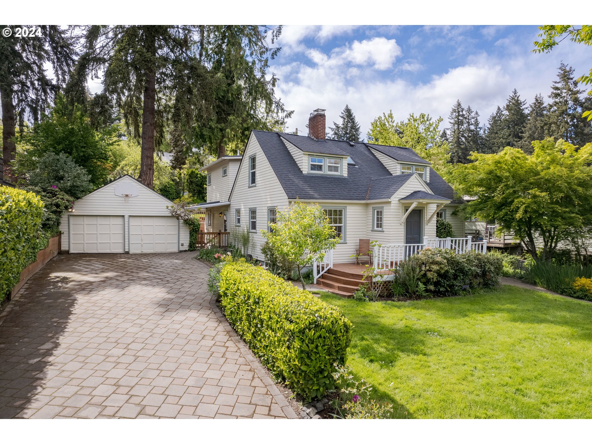 Open house Sat 5/11 from 11a-2p! Well-loved & beautifully remodeled, move-in ready bungalow in ideal South University neighborhood just blocks to UO, Laurelwood, Hendricks, restaurants, shops & schools! With 4 beds, 3.5 baths, almost 2700 sqft of light-filled living space, an 832 sqft unfinished (dry!) basement and a detached 2-car garage on a .29 acre lot that spans all the way from Emerald St back to Onyx, this property truly has it all. You'll love the period charm in the front living/dining area with entry portico, coved ceilings, hardwood floors and gas fireplace insert. You'll also appreciate the new modern kitchen with quartz counters, wood shaker cabinets, and stainless appliances that leads to the spacious great room w/ maple floors & full wall of built-in cabinets & drawers. Rounding out the main level is 1 bedroom, 1.5 baths & convenient mudroom/side entry w/ covered breezeway. Upstairs features a huge primary bedroom w/ 3 closets, built-in dressers, French doors w/ Juliet balcony overlooking the tranquil yard & attached bath w/ dual-head tile shower, quartz counters & skylight. 2 more beds w/ built-in desks, a fully updated hall bath w/ tub + skylight & cozy reading nook w/ book shelves complete the 2nd level. Outside, you'll enjoy the new paver driveway, sunny front porch, multi-level deck in the private fenced backyard, tree fort with zip line, lush foliage, garden area & all of the incredible flowering bulbs, berries & fruit trees. Recent upgrades include new Lennox high-efficiency furnace/heat pump for central heat & A/C thruout, brand new Rheem heat pump water heater, and so much more. Ask your agent for the full list of extensive features & upgrades.
