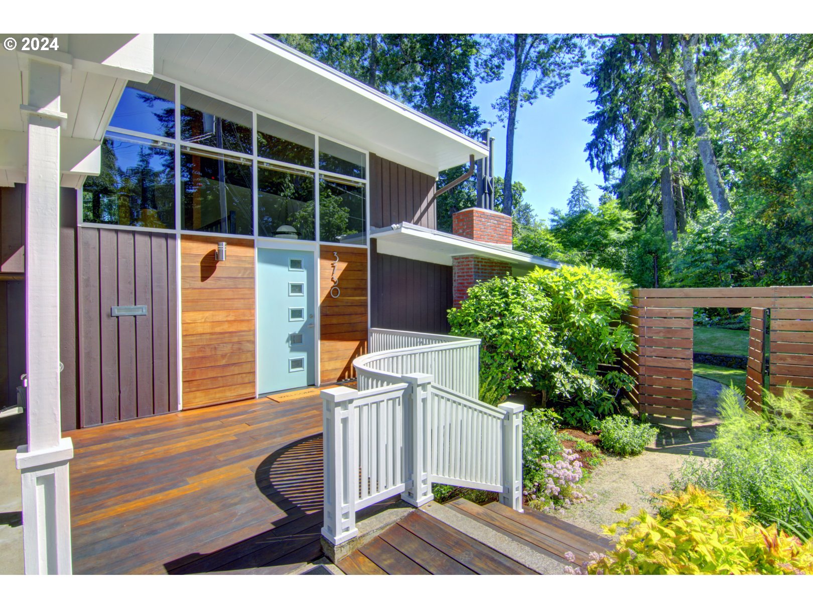 Denorval Unthank, Jr., local architect and namesake of Unthank Hall at the UO, designed this classic midcentury modern architectural gem in 1954. Now it's your chance to own a piece of design history. The owners have lovingly restored this home in the MCM style with all of the modern updates, new electrical, central heating and cooling, new plumbing, modern kitchen with new electric range and retro refrigerator. Windows and blinds are highly energy efficient. New water conserving toilets in updated period design bathrooms. Hardwood floors lead you to the peaceful bedrooms facing gardens and sunshine. Separate guest suite with full bath and private entrance for family and friends. Step out into the backyard patio area cover by white and lavender Japanese wisteria to the meticulously designed and maintained garden. The large barn is the perfect shop, art studio or possible ADU. There are fruit trees, raspberries, marionberries and figs to gather and separate fenced, organic garden beds as well. The hot tub off of the primary bedroom stays. 220v EV charge plug in the carport. The beauty of midcentury modern with todays modern conveniences.