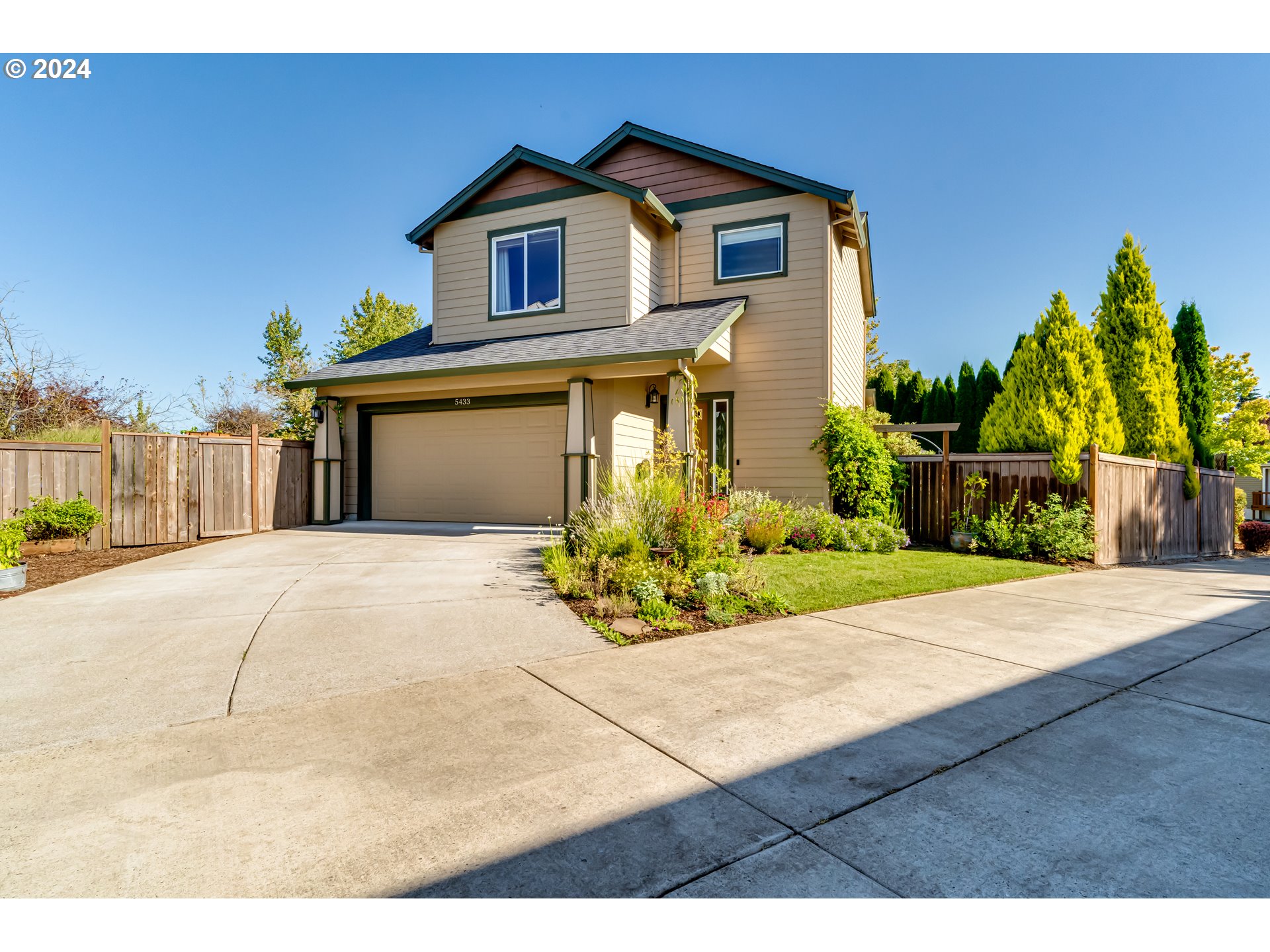 This beautifully maintained contemporary home is truly MOVE-IN READY! With 3 bedrooms, 2.5 bathrooms and located on a spacious corner lot in the serene Greenbrier Meadows neighborhood of West Eugene, this home presents ample parking, a fully fenced backyard that is a completely private oasis featuring a charming & generous covered deck perfect for year-round enjoyment, which is hot tub-ready for added relaxation. A beautifully established garden boasts raised beds, hops, multiple blueberry bushes, hardy kiwi, strawberries, grapes, herbs, fig, and apple trees—an outdoor enthusiast’s dream. Inside, the home’s high ceilings and thoughtfully updated layout create an open and inviting atmosphere. The kitchen has been refreshed with a new SS sink & dishwasher to compliment the other SS appliances. All bedrooms are located on the second floor, where you’ll find the convenience of the included washer and dryer just steps away—making laundry a breeze. The light-filled primary bedroom offers a walk-in closet and a private ensuite bathroom. Two additional bedrooms are supported by a second full bathroom with a shower/tub combo. The finished, deep garage provides plenty of storage, a 220V plug for EV charging, and features a sleek epoxy floor, adding to the home’s modern appeal. Don’t miss this opportunity and schedule your private tour with your favorite Realtor today!
