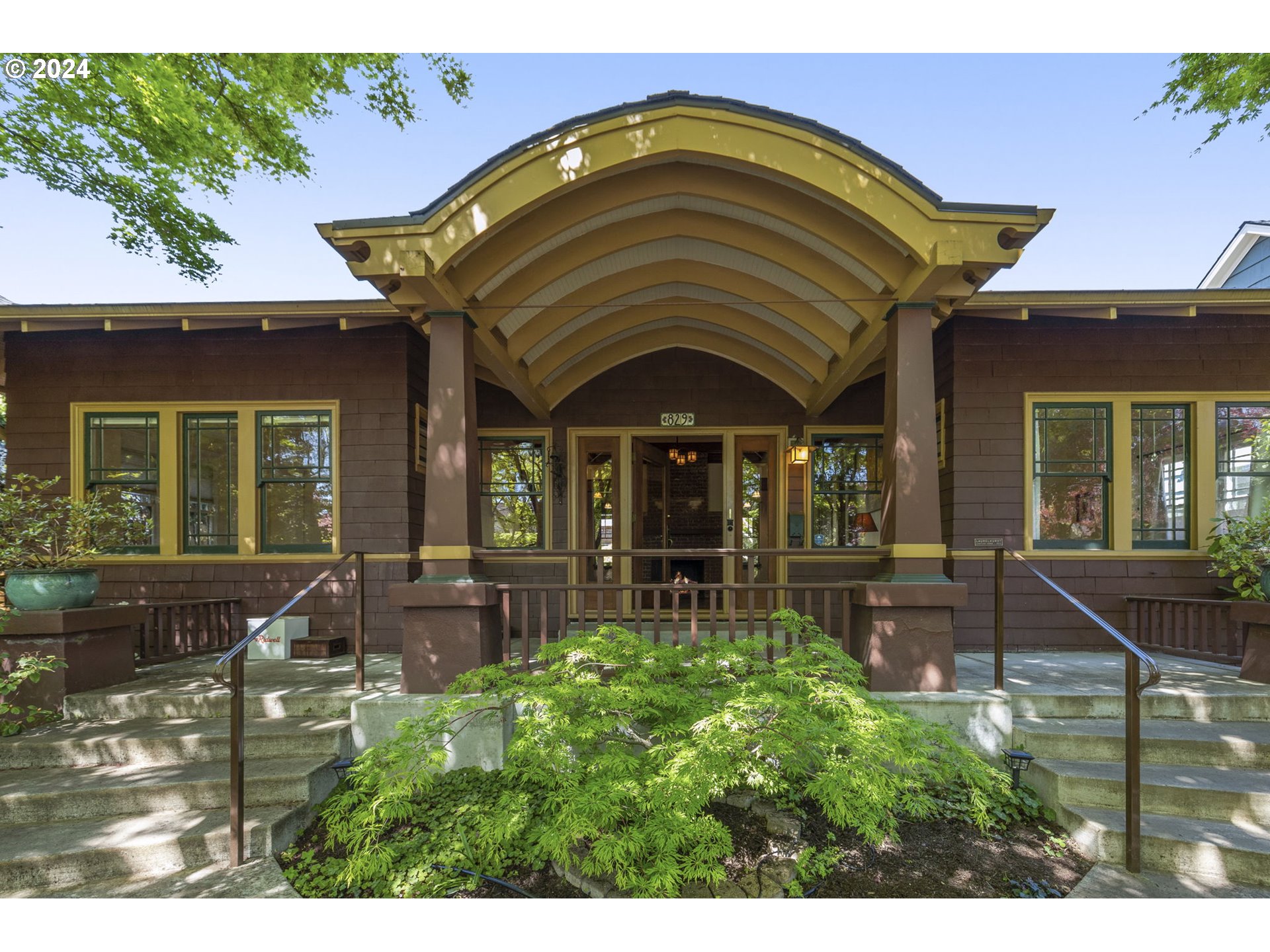 The quintessential historic craftsman bungalo.  Prime location in the heart of Laurelhurst. Beautiful artisan woodwork and craftmanship from 1910 with modern updates such as a 220 Electric Tesla charger, owned solar panels and increased insulation.  Additional access and parking on Peerless with separate living/work cottage with bathroom and shower plus 2 full bathrooms in the main home.