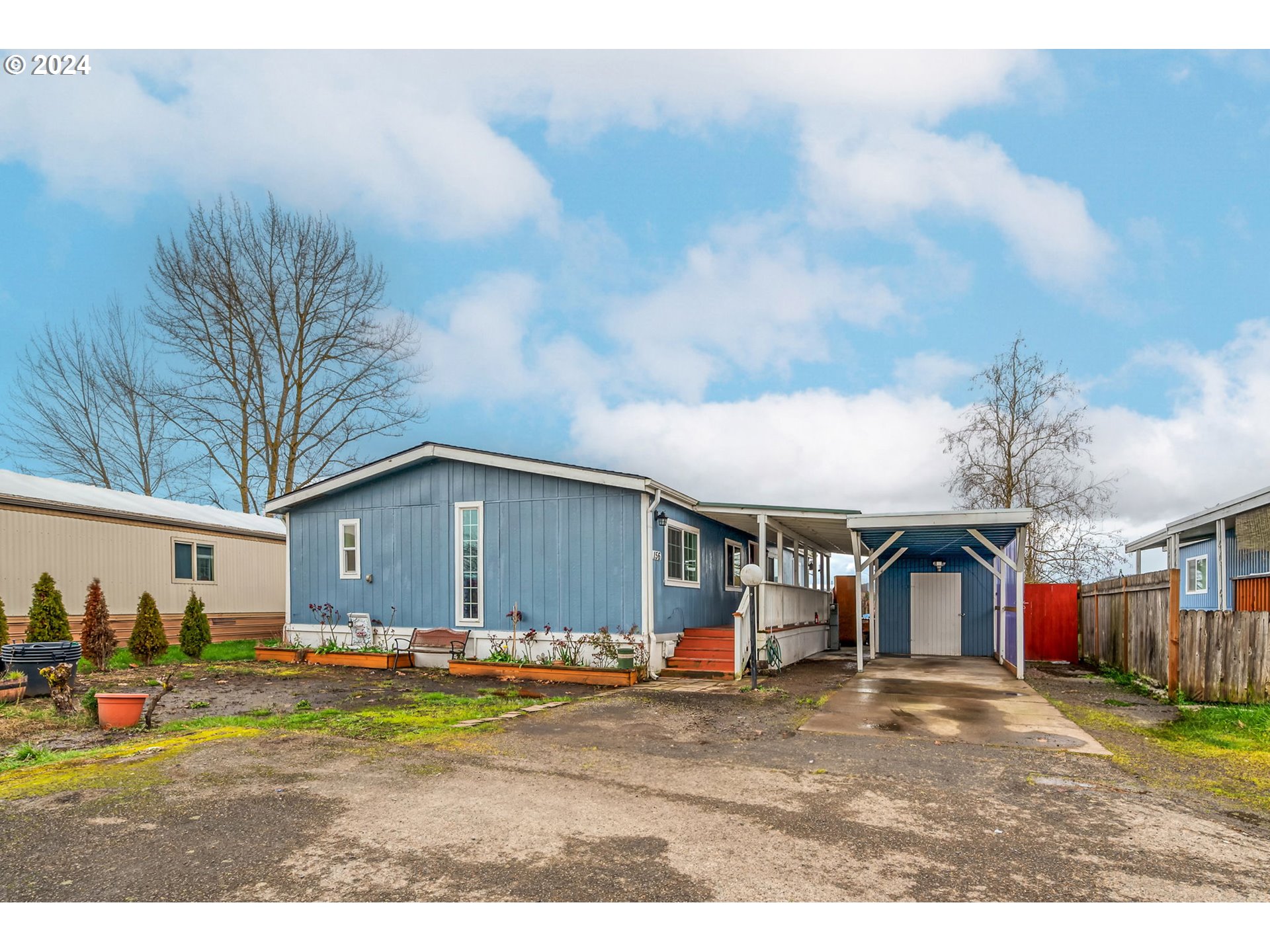 This is a beautiful updated and well cared for manufactured home in an all-age family park.  With an open floor plan and fantastic separation of space featuring 3 bedrooms, 2 full baths and an extra office room that can be easily made into a 4th bedroom. Also, new roof, new water heater, double pane vinyl windows and beautiful vinyl plank flooring through.   This home features a cover deck, 1-car carport, utility room, back covered wooden porch and a fully fenced yard perfect for entertaining. Come and make this your home!