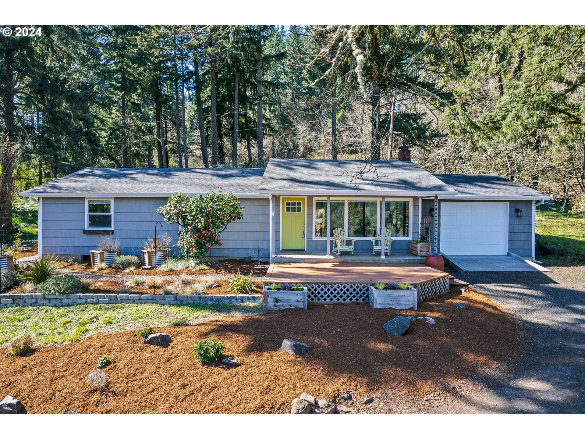 Are you looking for a move-in ready home and hobby farm on a picturesque property that is super close to town? Come check out 29649 Gimpl Hill Rd! 1-acre lot, single-level living and fully remodeled and modernized throughout. Custom kitchen featuring granite slab counters, white shaker cabinetry and stainless appliances. Enjoy stunning valley views thru the oversized picture window while cozying up to the wood-burning fireplace in the living room. Primary ensuite bedroom features like-new, tiled bathroom w/ walk-in shower. 2 additional bedrooms, a 2nd fully remodeled bathroom, laundry room w/ W/D included and a large 1-car garage round out the home. Out front, you'll love the covered porch and large deck overlooking the pasture, sunny fenced garden and classic red barn. In back, you'll find a private patio, a dog-friendly fenced yard, more grassy and large chicken coop with specialty laying area included. Fresh landscaping with lots of cool plants, 2 firepit areas (firewood included), 2 apple trees, 1 pear tree, a few cherry trees, 5 mature blueberry plants, 2 grape vines, tons of lavender, a holly tree, plus lots of wild iris and daffodils. Other features include LED lighting, waterproof LVP flooring, vinyl windows, newer electrical panel, newer ductless heat pump, whole home water filtration system, tons of parking for RV or boat, and more. The appliances and the riding mower are included in the sale. All this and just 1/2 mile to Bailey Hill Market, 1 mile to Wild Iris Ridge Trailhead and 2 miles to Churchill High School!