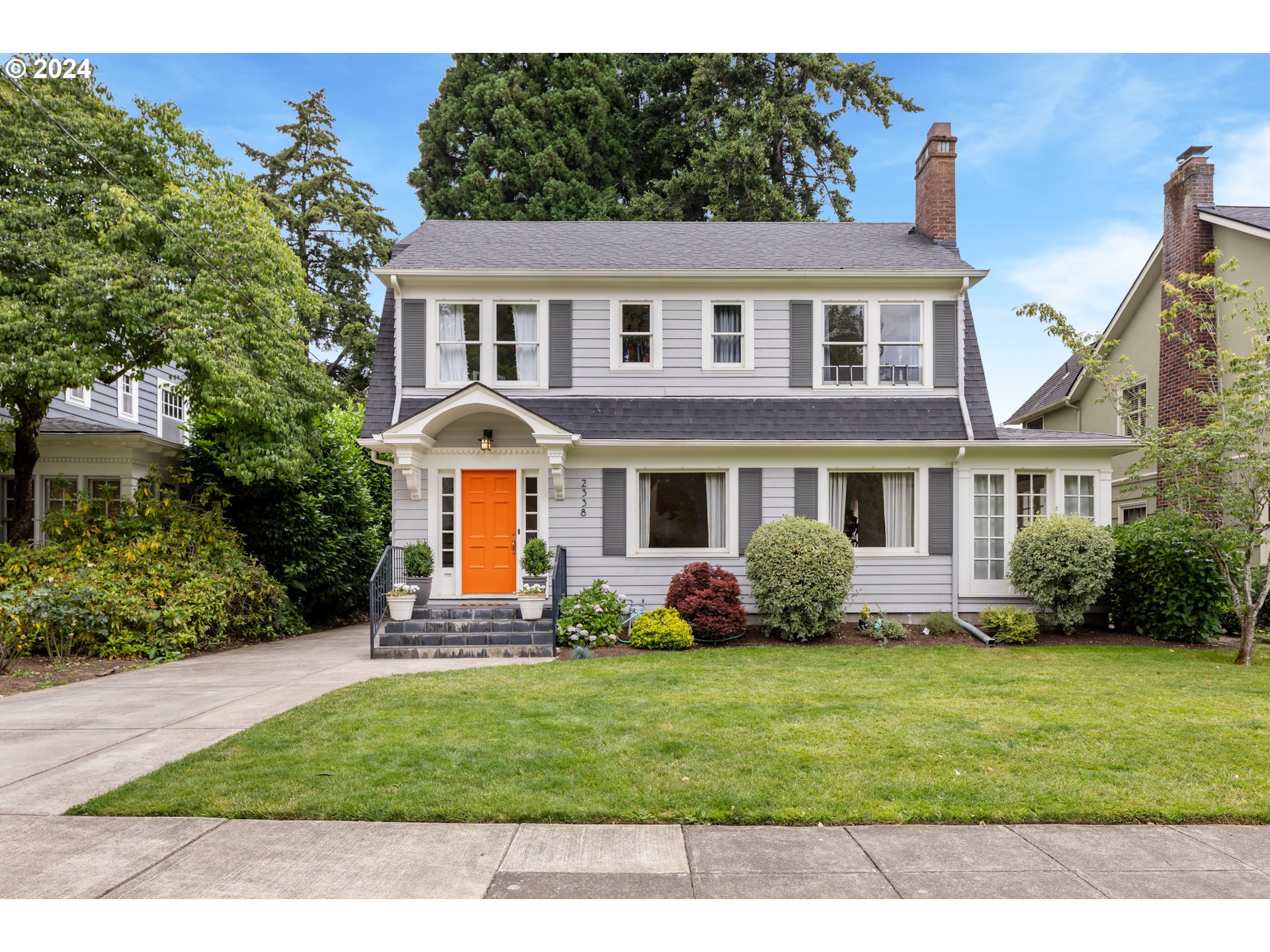 Welcome to your dream home in the coveted Dolph Park neighborhood of NE Portland. This stunning 1926 Dutch Colonial is a true gem, boasting a rare oversized lot (7,150 sqft) that provides ample space and privacy. Step inside and be greeted by the timeless beauty of refinished hardwood floors that flow seamlessly throughout the entire home. With 3 bedrooms and 2 baths, this residence offers comfort and functionality for everyday living. The finished basement of this home has been thoughtfully designed to cater to your needs. Currently set up as a family room and guest suite with a full bath and separate entrance, it presents an incredible opportunity for a potential accessory dwelling unit (ADU). Whether you desire a private space for guests, a home office, or a rental opportunity, this versatile area offers endless possibilities. The kitchen boasts stainless appliances, gas cooking, a farmhouse-style sink, and quartz counters. A cozy nook off the kitchen with leaded glass built-ins adds a touch of elegance and charm. The living room is the heart of this home, boasting an art deco inspired fireplace and large picture windows that fill the space with natural light. Adjacent to the living room is a light-filled sunroom, creating a serene retreat where you can work, reflect, or immerse yourself in a good book. Step outside and discover a large backyard and patio, perfect for hosting memorable dinners and entertaining guests. Whether you envision weekend barbecues or simply enjoying the fresh air, this outdoor oasis is sure to impress. Don't miss the opportunity to call this beautiful Dutch Colonial your own. Experience the charm of Dolph Park living and create a lifetime of cherished memories in this extraordinary home.