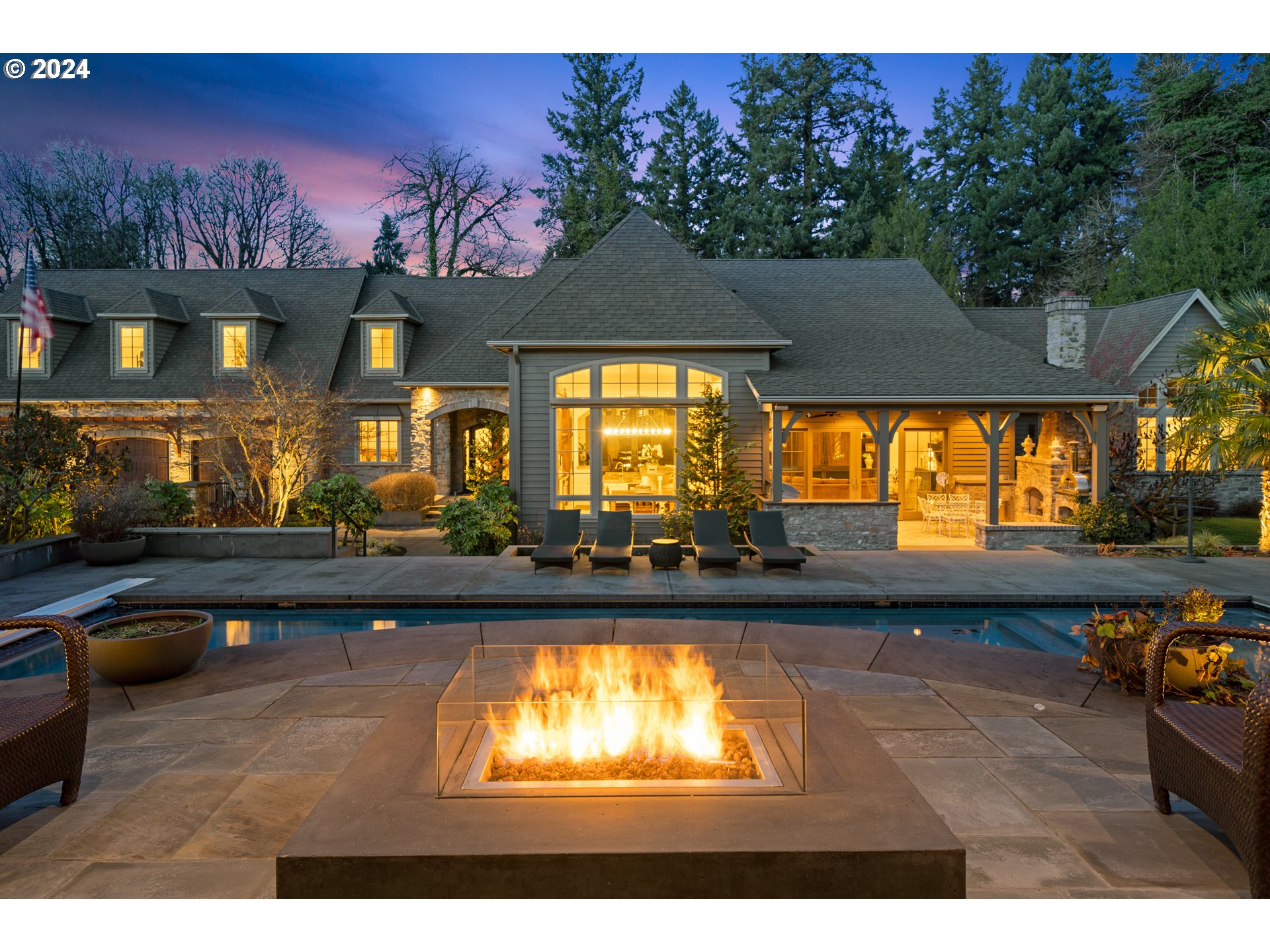 Presenting an unparalleled oasis in the heart of Lake Oswego, originally designed by the Olson Group Architects and brought to life by the craftsmanship of Stoneridge Custom Development. This exclusive 1.88-acre estate, ensconced within a secure gated enclave, offers a lifestyle of extraordinary luxury and privacy. At its heart lies an awe-inspiring pool, accompanied by a spacious vaulted pool house that defines the epitome of upscale entertainment - complete with a DJ stage, a sophisticated kitchenette/bar, and a versatile home office/studio, and oversized two-car garage with lift. The residence itself is a testament to elegant comfort, boasting a thoughtful layout designed for both grand entertaining and intimate day-to-day living. The main floor is anchored by the vaulted primary suite, offering privacy and separation from the rest of the home and featuring a spacious closet with custom built-ins and laundry. The second floor unveils a unique split design, featuring a spacious guest suite with laundry and spacious storage/bonus room that is opposite to the other wing, which is home to four additional bedrooms and home gym. Perfect family home with a stunning library retreat and basement home theater. Every detail is accentuated by soaring ceilings with robust wooden beams and expansive windows, bathing each generously proportioned room in natural light and privacy. Additional features include an oversized attached three-car attached garage and a dedicated RV pad, solar pool heating, and newly expanded backyard. Situated on the edge of a 6.8-acre nature park with five miles of trails in the esteemed Forest Highlands neighborhood, you enjoy close proximity to both downtown Lake Oswego and Lake Oswego High School. Unincorporated Clackamas County.