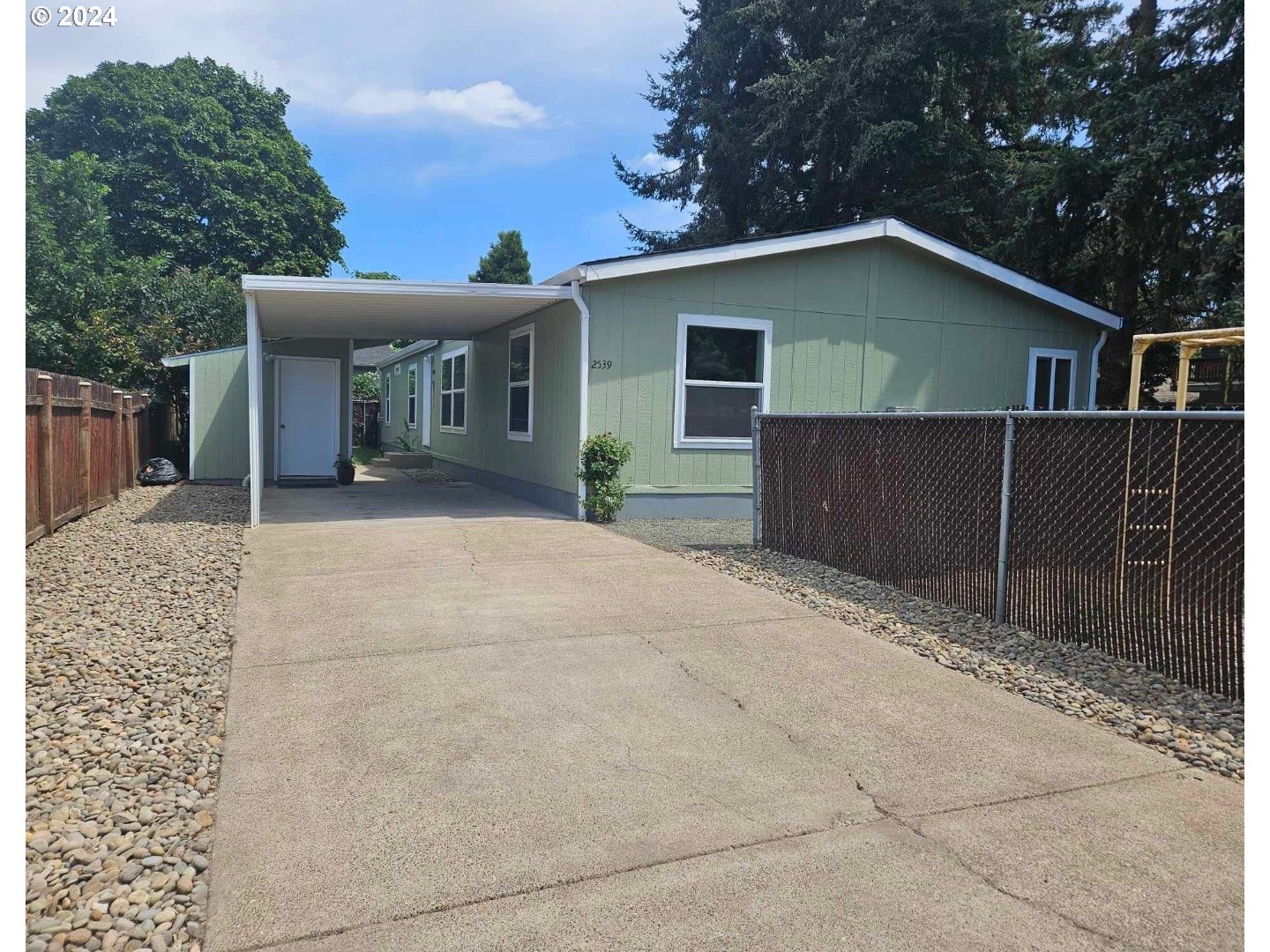 Updated Redman Manufactured home in a family park. Rare find of five bedrooms and three full bathrooms. Primary bedroom has a giant walk in closet. This home is very well kept and has newer appliances including new dishwasher, new range hood, new countertops, new flooring. Fresh interior and exterior paint. 2 yr old washer/dryer, fridge and range included. Also includes an above ground pool and playground right next door! Buyer must get park approval.