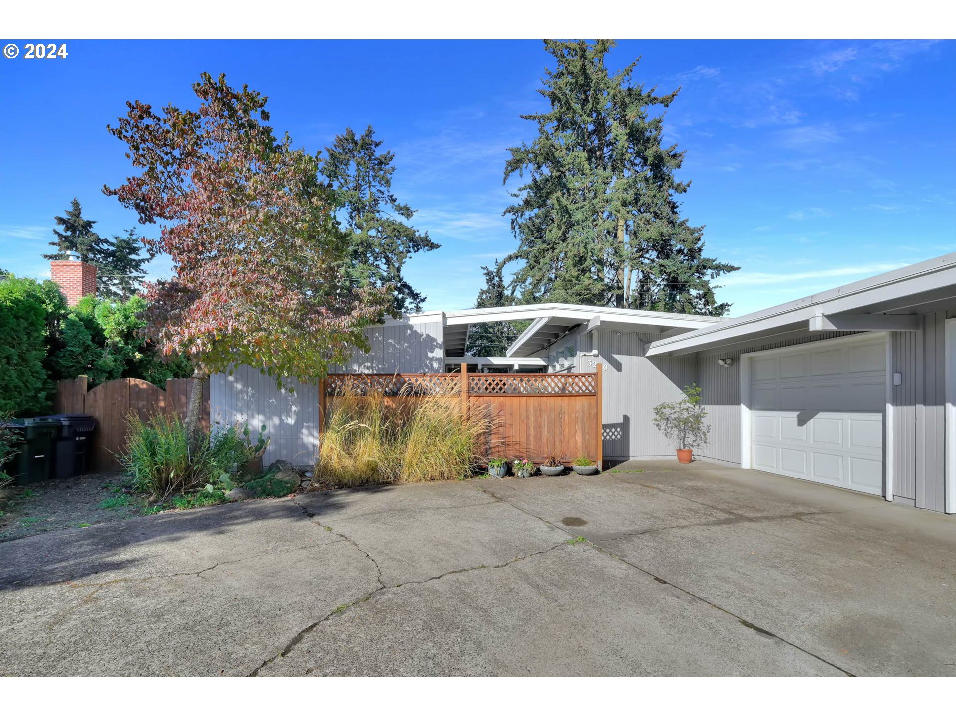 Step back to 1964 and experience the timeless elegance of this midcentury modern home, thoughtfully crafted with quality and intention. Enjoy an abundance of natural light streaming through the stunning floor-to-ceiling windows, perfectly framing views of the private backyard oasis.The remodeled kitchen and bathrooms blend modern amenities with classic design, making this home as functional as it is stylish. Whether you're entertaining or simply relaxing, the inviting spaces and serene atmosphere make this home a true retreat.