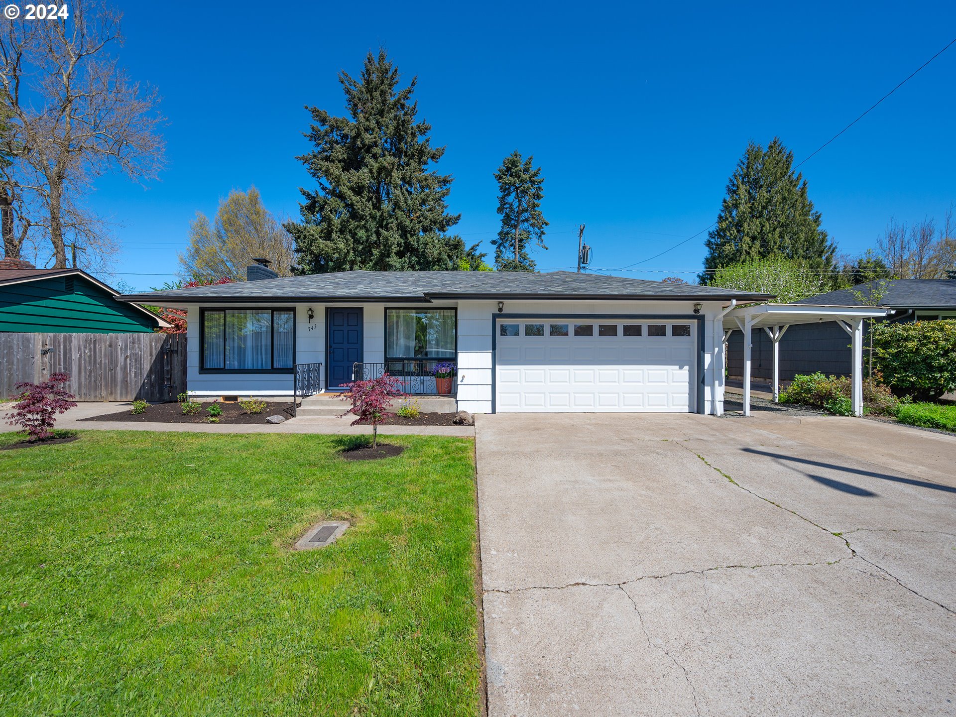 Discover the perfect blend of comfort and convenience in this beautifully updated single-level home, ideally suited for anyone seeking a four-bedroom, two-bathroom residence. Experience a thoughtful layout that offers ample separation of space, perfect for remote work or simply enjoying some privacy. Recent updates include refinished hardwood floors, a new heating and cooling system, and stylishly renovated kitchen and bathrooms. Entire home has been freshly painted both inside and out. This home is designed for both functionality and leisure, featuring a large laundry room with a utility sink, a spacious two-car garage with new door, and a 12x16 workshop equipped with electricity. The fourth room is currently staged as a bedroom, though it lacks a closet. It features a separate entrance, making it an ideal space for an office or the perfect spot to run a home business. exterior includes paved RV parking with a sewer hookup, ensuring convenience for your travel needs. Nestled in a tranquil neighborhood, this home is within walking, biking, rolling distance of Howard Elementary School and North Eugene High, and it's just a short five-minute drive to the Santa Clara Shopping Center. The sunny front yard and private, fenced backyard provide a delightful mix of sun and shade, creating an inviting atmosphere for relaxation and entertainment. Schedule your showing before it?s sold. Se Habla Español